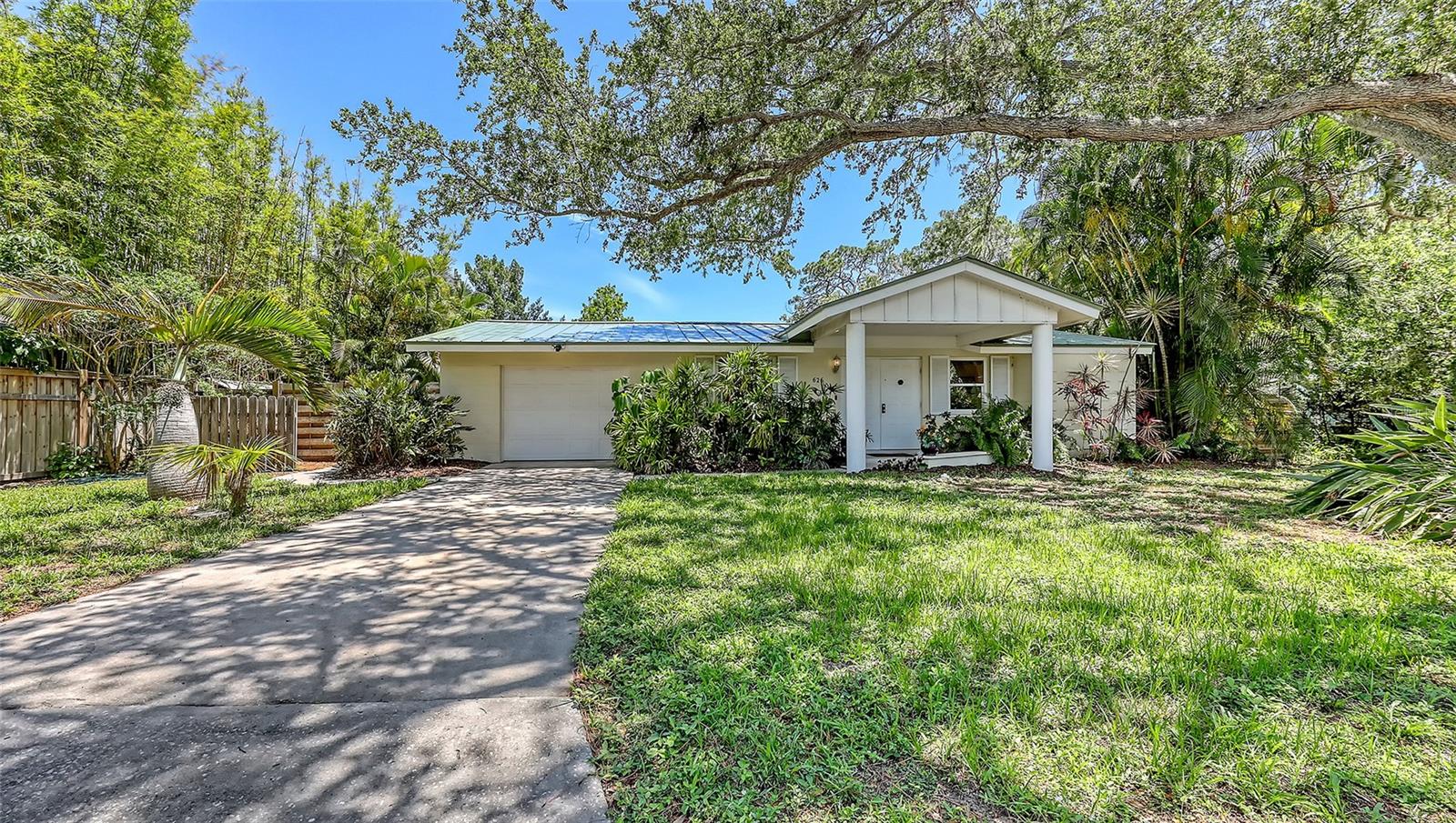 Tucked away in a quiet Cul-de sac beneath the shady canopies of the much sought after Indian Beach neighborhood, this charming 2/2 home offers the perfect blend of comfort and location. Just a few blocks from the picturesque shores of Sarasota Bay, evenings come with a complimentary sunset show that never disappoints. Step inside to find a mid-century gem, thoughtfully updated. The renovated kitchen boasts wood cabinets, granite countertops and stainless-steel appliances. The open floor plan flows seamlessly into the living area, all overlooking a fully enclosed 40-foot, heated pool and covered patio. Both front and backyards are landscaped for beauty and ease, while recent updates include a metal roof, hurricane impact windows, new HVAC unit, smart thermostat and a fully replumbed water system complete with new water heater and filtration system. Big upgrades equal fewer headaches. This home is as practical as it is appealing.
Just minutes from Ringling museum, downtown Sarasota, St. Armand's Circle, and the sun-drenched shores of Lido and Longboat Key beaches, this location is the definition of convenience. Whether you're headed to the beach, a gallery, or your favorite local restaurant, you are never far from where you want to be!