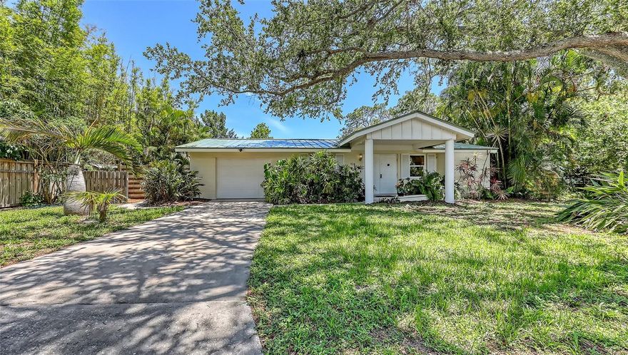 Tucked away in a quiet Cul-de sac beneath the shady canopies of the much sought after Indian Beach neighborhood, this charming 2/2 home offers the perfect blend of comfort and location. Just a few blocks from the picturesque shores of Sarasota Bay, evenings come with a complimentary sunset show that never disappoints.  Step inside to find a mid-century gem, thoughtfully updated.  The renovated kitchen boasts wood cabinets, granite countertops and stainless-steel appliances.  The open floor plan flows seamlessly into the living area, all overlooking a fully enclosed 40-foot, heated pool and covered patio.  Both front and backyards are landscaped for beauty and ease, while recent updates include a metal roof, hurricane impact windows, new HVAC unit, smart thermostat and a fully replumbed water system complete with new water heater and filtration system.  Big upgrades equal fewer headaches.  This home is as practical as it is appealing.
Just minutes from Ringling museum, downtown Sarasota, St. Armand's Circle, and the sun-drenched shores of Lido and Longboat Key beaches, this location is the definition of convenience.  Whether you're headed to the beach, a gallery, or your favorite local restaurant, you are never far from where you want to be!