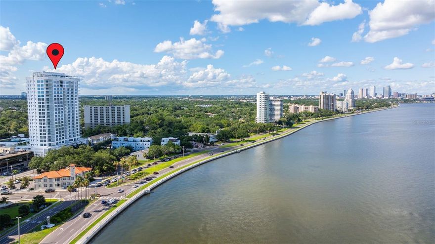 Seller may consider buyer concessions if made in an offer. Immerse yourself in sky luxury living! Located on the eighth floor, this splendid residence offers breathtaking waterfront views of the bay and Tampa's formidable skyline. Altura Bayshore, rising above Bayshore Blvd., offers an unprecedented rooftop experience, including a sky pool, sunrise and sunset views, water views, and this striking, ample, and modern brand-new condo.

The concierge welcomes you to the elegant lobby with exquisite decor, marking the start of a magnificent resort lifestyle!

This residence boasts 2,896 SF and has been designed with front-to-back, floor-to-ceiling glass, and numerous windows for unparalleled views. It features a private elevator foyer to greet your guests, three Bedrooms, a den that can be converted to 4th Bedroom, three Bathrooms, a terrace, a balcony, two reserved parking spots, and EV charging. This impressive total of 3,252 SF makes this property feel like a spacious home.

The flooring, counters, cabinetry, and doors are tasteful, and high-quality upgrades were selected to create sophisticated and welcoming spaces. The porcelain flooring is Daltile Hill House Natural 6x36 herringbone pattern, and the countertops are Silestone Hybriq+.

The gourmet kitchen is the ultimate display of personalization, superior craftsmanship, attention to detail, and elegant finishes. It is designed with an expansive island, upgraded cabinetry with added pantries, undercabinet lighting, and surplus cabinets under the island. Appliances include a Thermador cooktop and double ovens, a Fisher & Paykle dishwasher, a Miele refrigerator, and a freezer with seamless paneling.
 
The Owner's retreat has gorgeous bay views, terrace access, a generous walk-in closet, and a magnificent spa-like bath. Secondary bedrooms are spacious and offer great views.
 
Two expansive amenity decks with glass rail for unobstructed views feature a large rooftop pool with a lap lane and sun shelf, cabanas, and lounges, a large trellis-covered spa and bar, flat-screen TV, BBQ grills, and swing chairs. The fire pit section overlooks the bay.
 
Inside, you will enjoy the private club room with a gas fireplace, casual seating, a large bar, and flat-screen TVs, perfect for entertaining.

On the 4th floor, you will find a fully equipped fitness center, putting green, fire pit, outdoor pickleball, half-court basketball, bocce courts, bar and grill areas, a wonderful dog park with shade pavilion, and convenient access to Guest Suites.

Additional features include a 24-hour front desk, secured garage storage space, and HVAC UV light. Stacked double Miele washer and dryer in laundry room with convenient built-ins.

Prime South Tampa, walkable, waterfront location with easy access to some of the area's most popular destinations for shopping, dining, and nightlife. Minutes from downtown, Tampa's cultural center and activities, business district, sporting events, and top-rated schools. Close to Tampa General Hospital, UT, International Airport, Riverwalk, Waterstreet, Amalie Arena, Channelside, and easy access to major highways. Short distance to a private airport and yacht club.
