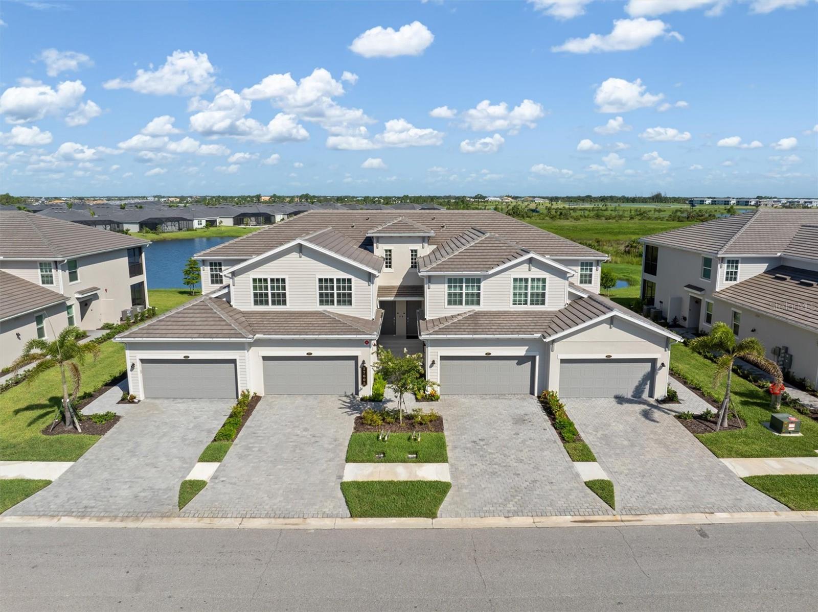 Live Where You Play! This gorgeous 2nd floor coach home in the sought-after Wellen Park Golf & Country Club is more than just a home—it’s a lifestyle upgrade! Featuring 3 spacious bedrooms, 2 baths, and a 3-car tandem garage, this home comes with a GOLF MEMBERSHIP INCLUDED—so you can hit the course anytime!
Step inside to discover fresh designer paint, modern lighting and fans, and a chic tile backsplash that perfectly complements the 42” cabinets and quartz countertops in the kitchen. The shiplap accent wall adds a splash of style to your open-concept living space, perfect for entertaining or relaxing after a round of golf.
Slide open the doors to your oversized lanai and take in the breathtaking lake view—now with brand-new roll-down shades for added comfort. The garage is not just massive; it’s been finished with epoxy flooring and built-in shelving. Additional storage has been thoughtfully added under the stairway to keep everything neat and organized after those Costco runs.
At just under 2,300 square feet, this coach home will show and feel more like a single-family home, with plenty of room to entertain family and friends.
Bask in the sun at the resort-style pool and spa, or enjoy a massage or pedicure at the full-service spa. If it’s fitness you crave, meet your friends for a pickleball, tennis or bocce match or start your day in the state-of-the-art fitness center and aerobics room. Your furry friends will love running off their leash at the new dog park, where you will surely meet new neighbors. All just minutes from Downtown Wellen Park, Venice’s historic district, and pristine Gulf Coast beaches.
Whether you're a golfer, beachgoer, or simply love the Florida lifestyle—this home has it all. Come see for yourself and fall in love!