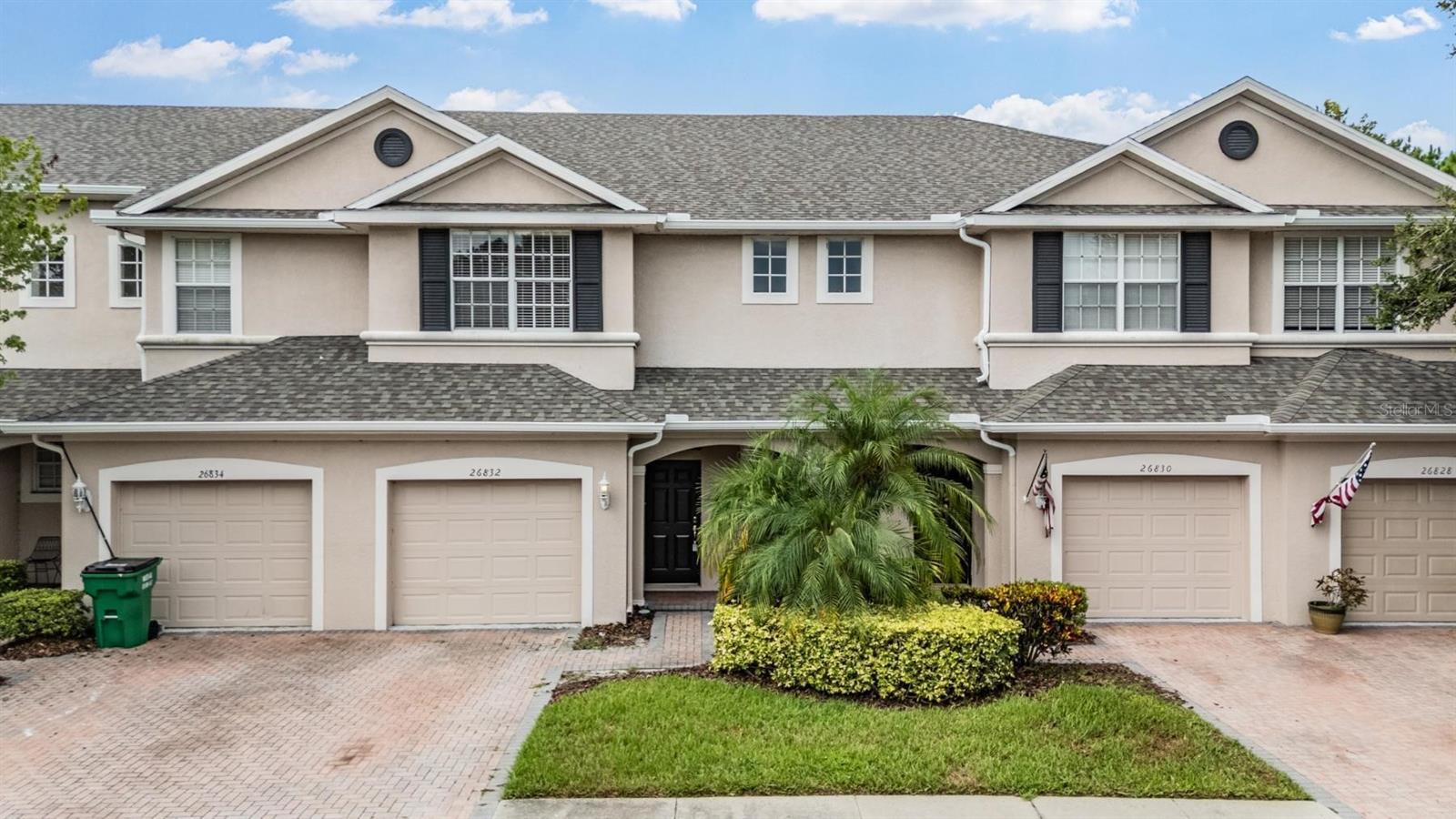 One or more photo(s) has been virtually staged. Beautiful 2 story townhome in gated Lakeside at Seven Oaks with peaceful POND view! 3 bedrooms, 2.5 bathrooms, loft space, and a one-car garage. Paver-lined driveway and covered front porch. The downstairs layout includes a Great Room open to the Kitchen, a half bathroom, under-stairs storage, covered patio, backing up to a POND with NO REAR NEIGHBORS. Kitchen features 42" Cabinets, Granite Counters, Stainless Appliance Package, large breakfast bar & pantry. Head upstairs to find a loft space - perfect for an Office or Play Area. Laundry room comes Complete With Washer and Dryer. The owner's Suite has 2 walk-in closets and an en-suite bath that features a spacious shower and Dual Sinks. Great opportunity to live in Seven Oaks! Centrally located near the best shopping, dining, entertainment & medical facilities Wesley Chapel has to offer. Seven Oaks features a clubhouse, pool with slide, splash park, Jr. Olympic size pool, cafe, Har-clay tennis courts, sand volleyball, basketball court, soccer field, nature trails, playgrounds, movie theater, gym & aerobics room. HOA fees cover water, sewer, trash, pest control, exterior maintenance and shingles.