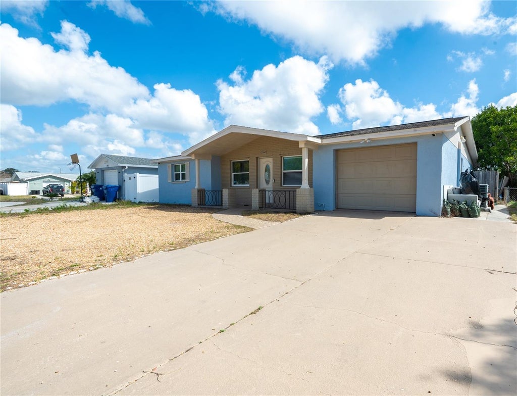 Photo of 1050 Deal Lane, Holiday, FL 34691 (MLS # O6415296)