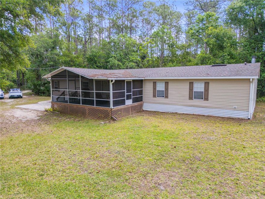 Private country living with room to spread out! This 4-bedroom, 2-bath manufactured home sits on 4.9 acres in
a peaceful rural setting just a short drive to Port Orange shopping, dining, and conveniences. Featuring an
open floor plan and a 2022 renovation, the home offers comfortable, updated living. Relax on the screened
porch overlooking the pond and enjoy the wildlife and natural surroundings. Roof installed in 2022 and an HVAC system installed in 2021. The property provides ample space for outdoor living, hobbies, and storage for boats, RVs, or equipment, with room for gardens, animals, or future improvements (subject to local regulations). Additional features include ample parking and potential for a workshop or outbuildings. Convenient access to New Smyrna Beach and Daytona Beach. A versatile opportunity for a primary residence, retreat, or investment—schedule your showing today!