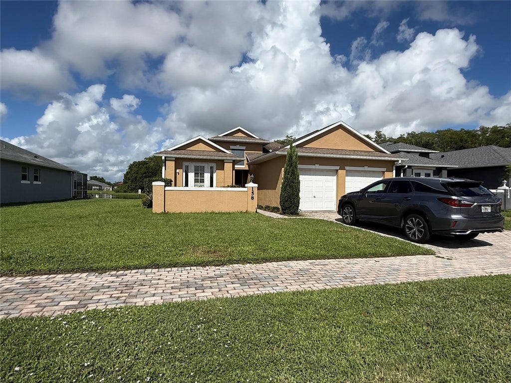 Photo of 158 Magic Landings Boulevard, Kissimmee, FL 34744 (MLS # O6438743)