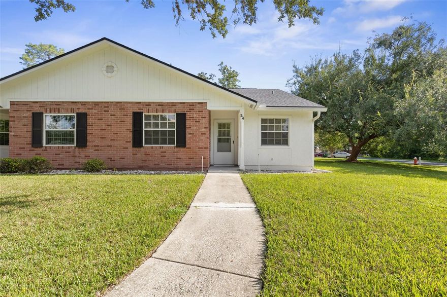 Enjoy effortless lakefront living in this highly desirable end-unit townhome offering stunning water views and the convenience of all one-level living. With no stairs to navigate and added privacy from its end-unit location, this 2-bedroom, 2-bath residence combines comfort, style, and simplicity in a peaceful waterfront setting.  Spanning 1,023 square feet of thoughtfully updated living space, plus an additional 113 square feet in the enclosed porch under heat and air, this home offers flexibility for a bright sunroom, home office, or serene sitting area overlooking the lake. Natural light fills the interior, enhancing the fresh, modern feel created by new luxury vinyl flooring, updated lighting, plumbing fixtures, chair-height toilets, new storm front door, new electrical sockets and switches, window treatments and freshly painted throughout.  Both bedrooms are generously sized and feature large walk-in closets, while the kitchen shines with new stainless steel appliances (2024) and cabinet refresh.  Major system updates provide added peace of mind, including a brand-new HVAC system (2025), new hot water heater (2024), Roof (2020) and new windows (March 2026).  The beautifully maintained community offers LOW HOA fees ($240 per month) that include water, sewer, trash, and exterior ground maintenance, making ownership both affordable and worry-free.  Assigned parking ensures you’ll always have a designated space waiting for you. (HOA requires background check.). Perfectly located near shopping, dining, medical facilities, paved walking and biking trails, and with quick access to I-95, this home is also just minutes from the beach—placing the best of coastal living right at your fingertips.  Whether you’re searching for a primary residence, seasonal retreat, or investment property, this one-level lakefront end unit delivers low-maintenance living with scenic views and exceptional convenience.   Schedule your private showing today and experience the lifestyle for yourself!