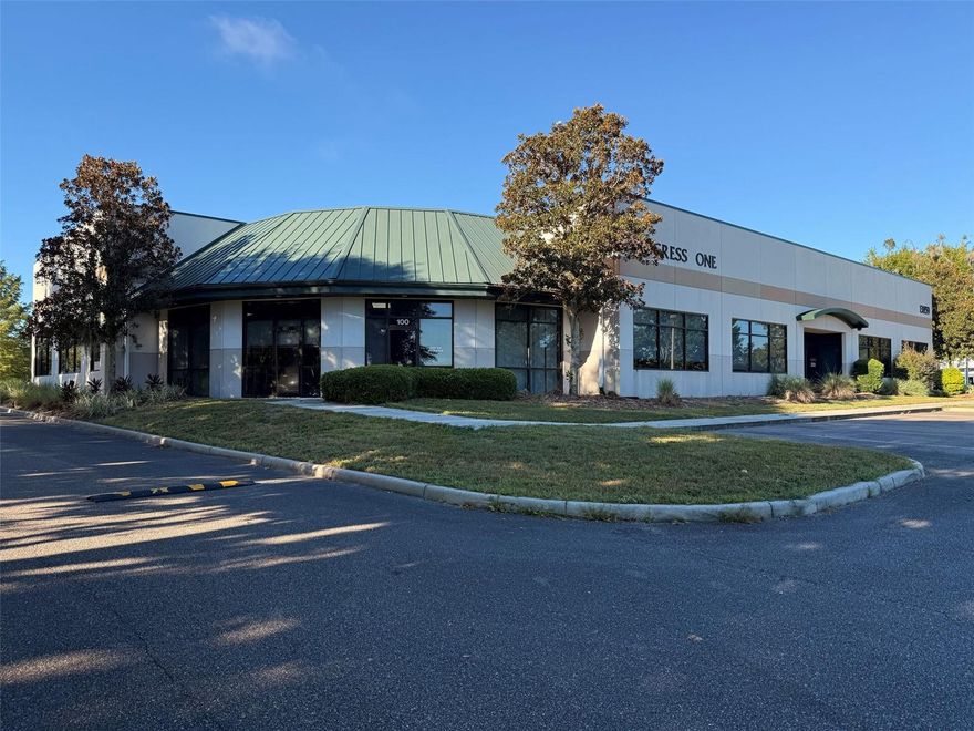 Progress One is a 22,476 square foot building with laboratory, office, and light manufacturing suites available for lease. Suite 100 is available for move-in, boasting 4,898 sq ft of office space ($22/sf), Suite 200 is available in multiple sizes for move-in, boasting 3,475 sq ft of office space total ($18/sf), Suite 200 is also available as Co-work suites, starting t $600 per office suite. Additional suites in Progress One are also available, ask for details. Highlights: Professional and well-appointed office spaces available for immediate occupancy in the heart of the Progress District in Alachua, FL, near Gainesville Regional Airport, UF, and I-75. Space sizes are flexible to suite your needs, from 100 sq ft (Executive Office with shared common elements) to 8,180 sq ft. Options to provide the space partially or fully furnished ae available. Unbeatable location, Place your company at the center of a powerful network, with Fortune 500 companies and a highly skilled local workforce at your doorstep. Ask about our move-in incentive and Listing Special! Suites 100 and 200 boast sizable conference rooms, restrooms, and a shared oversized kitchen area. The space can easily be combined should you require a larger space, or separated for occupancy by different companies. Suite 100 has an open and attractive layout, conducive to collaoration among the team, team meetings/training, and impressing your clients. Suite 200 is fully built out with a large, impressive conference room and 10 individual offices. Owner is open to leasing Suite 200 by individual offices, to provide a co-working style Executive Office Suites, allowing companies to lease smaller spaces (one or more individual offices) with the benefit of a shared conference room, restrooms, and kitchen. Ample parking for employees and visitors.