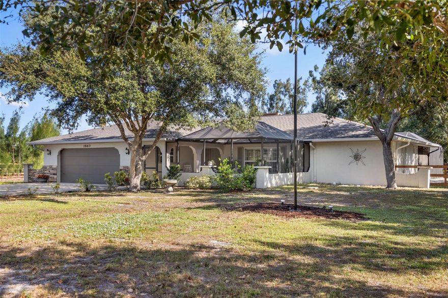 Welcome to this beautifully renovated estate-style home, set on a fully fenced 1.29-acre lot offering privacy, charm, and plenty of space to live, relax, and entertain. This 3-bedroom, 2-bath residence has been thoughtfully updated with a warm and inviting design, featuring crown molding, wainscoting, and custom built-ins that add timeless character throughout. At the heart of the home is the renovated kitchen and baths, blending modern finishes with classic details. The living spaces flow seamlessly to the expansive outdoor area, where you'll find a sparkling pool, covered lanai, and screened front courtyard - perfect for enjoying morning coffee while watching local wildlife and birds. The oversized 2-car garage, RV parking with hookup, and large shed provide exceptional storage and flexibility, while the spacious lot offers endless potential for a future outbuilding or second garage. The property is also zoned to allow horses and other types of animals.  Mission Valley Estates has an abundance of mature landscaping, highlighted by stately oak trees, creating a picturesque setting and welcome shade. Offering a peaceful country feel, this property is ideally located just minutes from Gulf beaches, major roadways, Sarasota Memorial hospital, shopping, dining, and more. This unique home combines character, updates, and land - something truly rare to find.