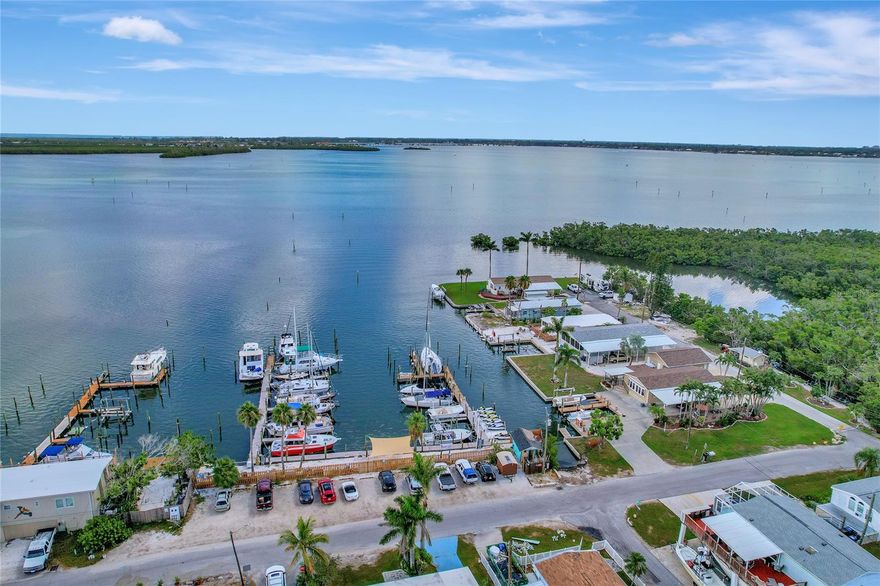 $5,000 BUYER CREDIT OF CHOICE WITH EXECUTED CONTRACT BY 12/31/25! Investor Alert - Prime Opportunity Near Anna Maria Island! Calling all savvy real estate investors - Here is your chance to OWN LAND in the sought-after SUNNY SHORES community of Bradenton, just minutes from the turquoise waters of Anna Maria Island. Located right off Palma Sola Bay, with Sunny Shores Park and the Parrot Cove Marina boat ramp in your backyard, this property is all about location, flexibility, and potential. This fully remediated over 1,400 sq ft home offers a solid foundation for your next investment project, featuring: Two additional enclosed living areas for added versatility, a NEW Shingle Roof (2025), a NEW A/C (2025), NEW Electrical (2025), home Raised and Insulated (2025), a spacious layout with significant square footage and generous closet spaces. With no rental restrictions and an optional $100/year HOA, you can create your ideal income property or personal Florida getaway. Bring your vision to life by customizing the finishes, adding your style, and maximizing returns in a high-demand coastal market! Sunny Shores is an active, golf-cart-friendly community with social amenities including a clubhouse, fitness center, library, and pool table. The boating lifestyle and sandy beaches are just minutes away, making this an ideal opportunity for long-term rental, seasonal stays, or a profitable vacation property. Invest in Florida living, personalize it your way, and watch your investment grow! Average annual rental income ranges between $2,000 – $2,500. Short-term rental opportunities are available through platforms like Airbnb and VRBO.