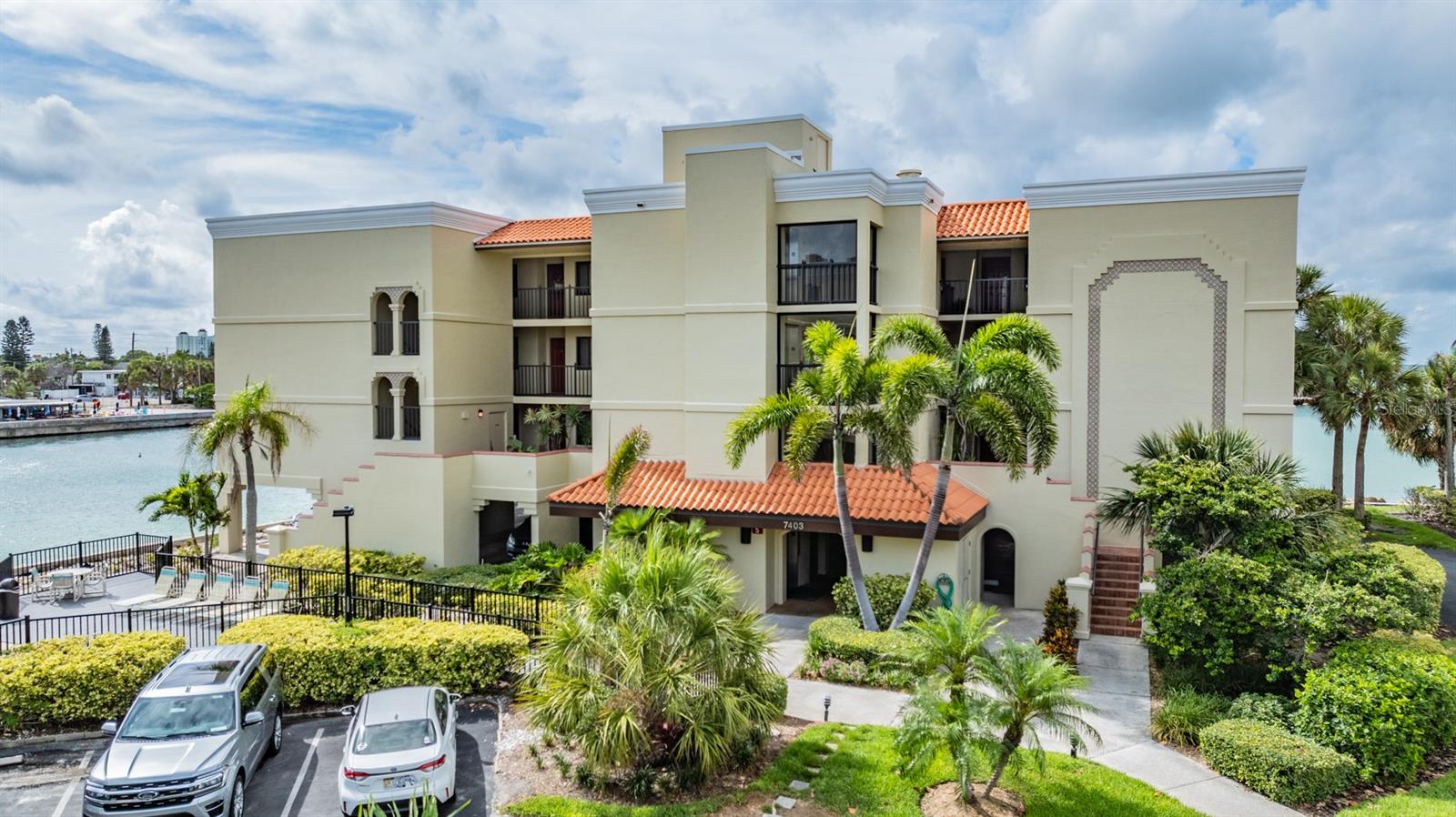 Welcome to paradise! Notably, this condo sustained no flooding or damage from Hurricane Helene or Milton! Island living on the southern edge of Sunset Beach in Treasure Island. This stunning waterfront condo offers luxurious amenities and breathtaking views of the Gulf of Mexico and Boca Ciega Bay. Situated on the tip of Treasure Island, this 2/2 features a spacious open floor plan with natural light, a gourmet kitchen with stainless steel appliances and granite countertops, and a private sunset balcony. Beautiful bathrooms with walk-in showers, oversized bedroom closets, solid wood interior doors, and completely furnished for a turnkey purchase. Keep your peace of mind during storms with the high-impact hurricane windows. Enjoy sweeping southwestern views of the Pinellas sandy beaches and Emerald water. Residents have access to resort-style amenities, including a swimming pool, hot tub, fitness center, clubhouse, and private dock. The primary bedroom boasts an en-suite bathroom with dual vanities, a walk-in shower, and a soaking tub. Additional features include a dedicated parking space, extra storage, and professional property management services for maintenance-free living. Enjoy proximity to pristine beaches, local dining, entertainment options, and downtown St. Petersburg's vibrant arts scene. Experience coastal living at its finest—perfect for a part-time residence or your primary home in one of Florida's best beachfront communities.