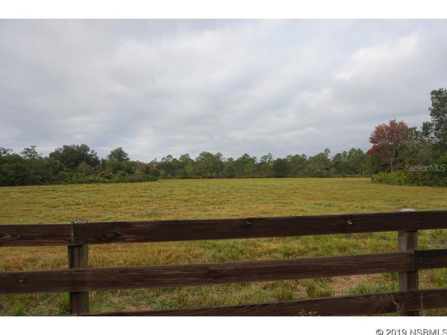 The country is calling....This beautiful, gated community is a perfect LOCATION between New Smyrna, Deltona, Sanford, and Daytona! Come build your home, with the contractor in the community.  Come enjoy the peace and quiet, only the country can offer. All lots are 5 acres or more, so you have privacy.  Next to Lake Ashby Park with a boat ramp, and Deep Creek Preserve, 20 minutes to the beaches in New Smyrna, or to the Sanford Airport. Plenty of room for horses, a garden or two, or park your RV out back. This lot is approximately 7.0 acres, surveys are needed for exact dimensions. The lot will need a private well and septic system. Builder Restrictions.; Cleared: Partial