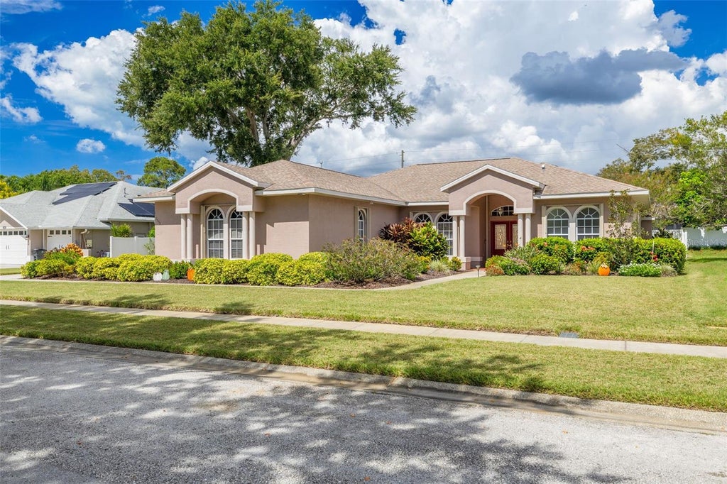 Photo of 1555 Sunray Drive, Palm Harbor, FL 34683 (MLS # TB8554514)