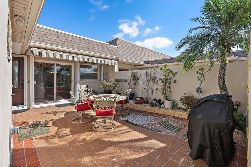 Beautifully restored 2-bedroom, 2-bath waterfront villa in Boca Ciega Point—the premier 55+ boating community! One of the larger two-bedroom layouts, this home offers water views from most of the unit, plus a covered and screened-in patio overlooking the canal, your own dock, and a boat lift. Completely and professionally restored after Hurricane Helene with full permits and inspections approved. Features a brand-new kitchen with quartz countertops, white and gray cabinetry, and all-new GE stainless-steel appliances. Ceilings have been newly retextured throughout the home for a cleaner modern look. Oversized master bedroom with beautifully updated ensuite bath featuring dual vanities. Impact-rated Pella windows and sliding doors in front of the unit and hurricane shutters provide peace of mind. Wood-look tile flooring in the kitchen and bedrooms. With a new roof, freshly painted building, and a seawall certified for 20 more years of life, a new owner can enjoy added peace of mind regarding major structural components. Monthly fee includes Spectrum cable/internet, water, sewer, trash, grounds maintenance, escrow reserves, and multi-peril building insurance. Enjoy boating, clubhouse, heated pool, tennis, and an active social lifestyle just minutes from Madeira Beach!