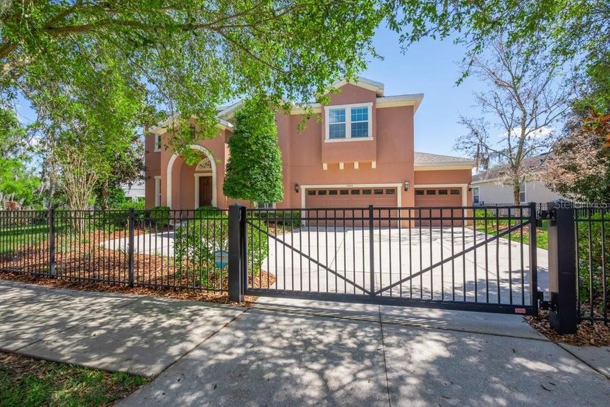 WESTBAY POOL HOME - Located in the heart of FishHawk Ranch’s highly desirable Garden District, this elegant WestBay Caladesi III pool home offers 5 bedrooms, 4 bathrooms, a 3-car garage, and 3,811 sq. ft. of thoughtfully designed living space. A private gated entrance and fully fenced yard welcome you to this spacious two-story home featuring oversized rooms and numerous upgrades, including a NEW ROOF (2025 with 10-year transferable warranty). A grand double-door entry opens to a formal foyer and dining room with volume ceilings, tile flooring, and 8-foot glass French doors leading to a large den—perfect for a home office or study. The gourmet kitchen is designed for both entertaining and everyday living with stainless steel appliances, gas cooktop, separate wall oven and microwave, granite countertops, a center prep island, and 42” cabinetry, while the breakfast nook and expansive family room overlook the covered lanai, sparkling pool, and large backyard through energy-efficient windows and sliding glass doors. A first-floor game room with adjacent full bath provides flexible living space and could easily serve as a sixth bedroom, guest suite, or mother-in-law suite. Upstairs, the impressive primary suite features double-door entry, a bright sitting area, and a luxurious bath with dual granite vanities, garden tub, walk-in shower, water closet, and two oversized walk-in closets. Four additional bedrooms, two full baths, and the laundry room complete the second floor. Recent improvements include new carpets, fresh interior and exterior paint, hot tub pump, pool timer, pool screens, pool heater, upstairs A/C, and a tankless water heater. Ideally located within walking distance to Park Square, the Aquatic Center, FishHawk Creek Elementary, shopping, and dining, residents enjoy world-class amenities including resort-style pools, nature trails, tennis and basketball courts, playgrounds, and top-rated A-rated schools in one of Tampa Bay’s most sought-after master-planned communities.
