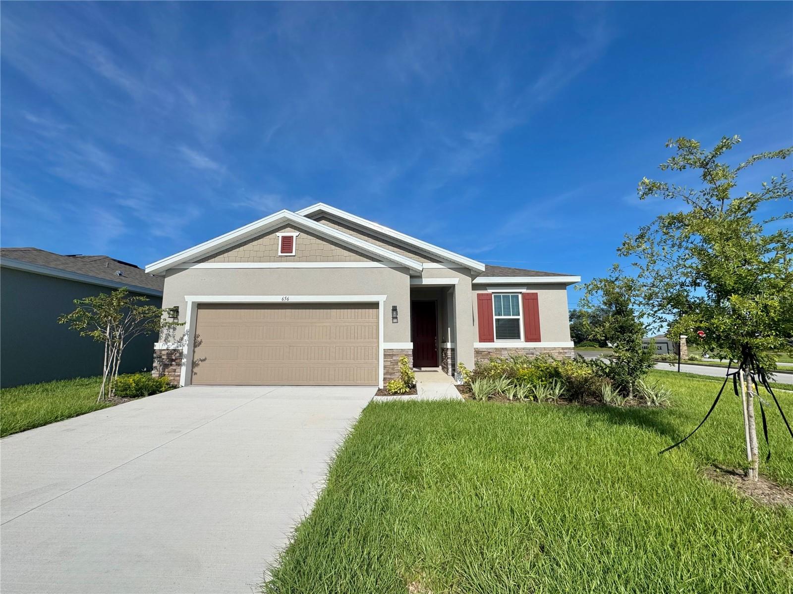 Move into luxury on a desirable corner lot—be the very first to call this brand-new Richmond beauty “home”! This thoughtfully designed split-bedroom layout blends style, comfort, and functionality. The expansive great room flows seamlessly into the dining nook and an impressive kitchen, complete with a center island with breakfast bar, 42" cabinets, quartz countertops, and a walk-in pantry. You’ll love the 8-foot doors throughout, including sliding glass doors with a 6-foot entry leading to the 8x15 covered lanai—perfect for effortless entertaining. Tucked away off the great room, the primary suite offers two walk-in closets and a private bath retreat with dual sinks on an elevated countertop, a walk-in tile shower, and a private water closet. Two additional bedrooms are located off the foyer and share a full bath. The laundry room, conveniently positioned near the primary suite, comes equipped with a washer, dryer, and spacious linen closet. Beautiful wood-look tile throughout the main living areas and plush carpet in the bedrooms. Ready to move in?