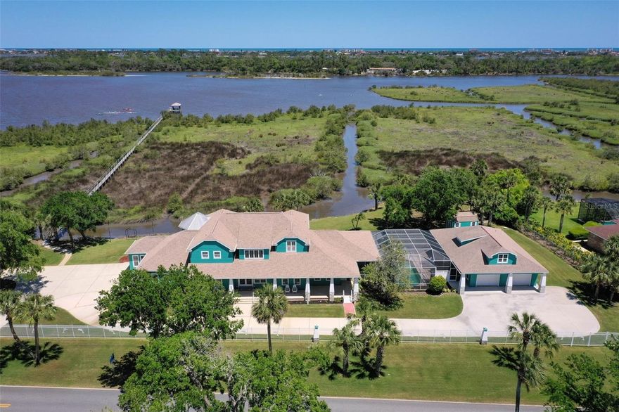 Welcome to your private sanctuary on Ormond Beach's iconic Scenic Loop, where natural beauty meets refined living. This coastal craftsman style pool home is situated on 308 feet of direct riverfront along the tranquil waters of the Tomoka Basin. Easy access from your dock to the Tomoka River, Intracoastal and the Atlantic Ocean. This estate is a true gem and perfect for multigenerational living. Featuring 4,619 square feet of impeccably maintained living spaces with a guest house and mother-in-law suite on the main floor. Soaring ceilings and massive amounts of glass to take in the amazing vistas of the water and marsh area. This home is thoughtfully designed for comfort, flexibility, privacy and entertaining. Ideal for extended families or guests, with it's 5 spacious bedrooms (including 3 on the main floor and 2 upstairs) plus 4.5 baths. Whether hosting family reunions or enjoying a peaceful retreat, there's room for everyone. The residence has a newer roof, has been freshly updated throughout with brand new authentic hickory hardwood flooring, new interior and exterior paint, new lighting, fans, linear fireplace and much more. Beautifully maintained and absolutely turnkey, with nothing to do but move in and soak in the scenery. Enjoy stunning water and nature views from nearly every room, many covered porches, the summer kitchen, the two balconies, all overlooking your very own estuary. Even the private saltwater pool which is just perfect for a refreshing dip on warm Florida days has the stunning views. The gated entry ensures privacy, while a generous driveway and 2 separate garages have the space to accommodate up to  7 cars making this an ideal spot for car/toy enthusiasts. A nicely sized storage shed is on property as well. Out back, cast a line or set off on an adventure from your private dock that can easily accommodate a pontoon, flats boat, paddleboards and kayaks, making this a boater's and angler's paradise. This rare offering is more than a home, it's a lifestyle, a retreat, and a place where generations can come together and make memories.
Nothing to do here but move in and enjoy one of the best views in the entire county!