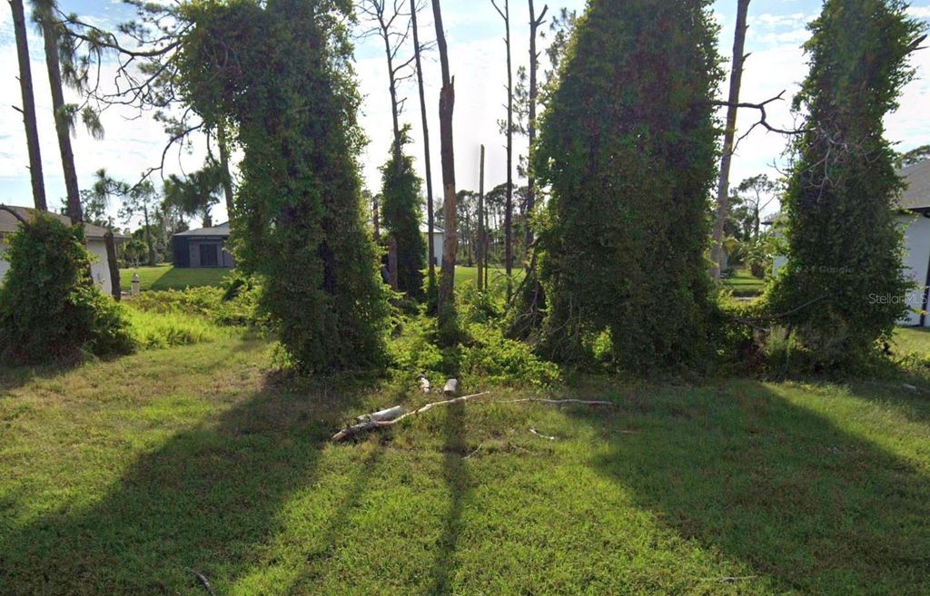 Photo of 261 Tournament Road, Rotonda West, FL 33947 (MLS # O6382155)