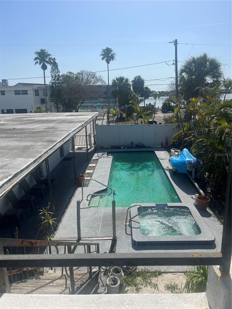 Needs total renovation or could be excellent development site. Across the street from the public access of the intercoastal. Property has waterview. 4 units could possibly be 5. Pool and spa. Owner would possible conside financing. Walt to beach. Public tennis courts.