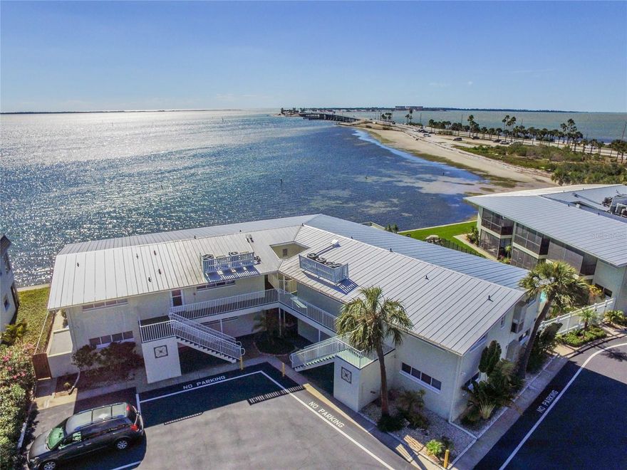 Concord Arms community in excellent Dunedin Causeway location.  Studio unit with large screened lanai with pool and water view.