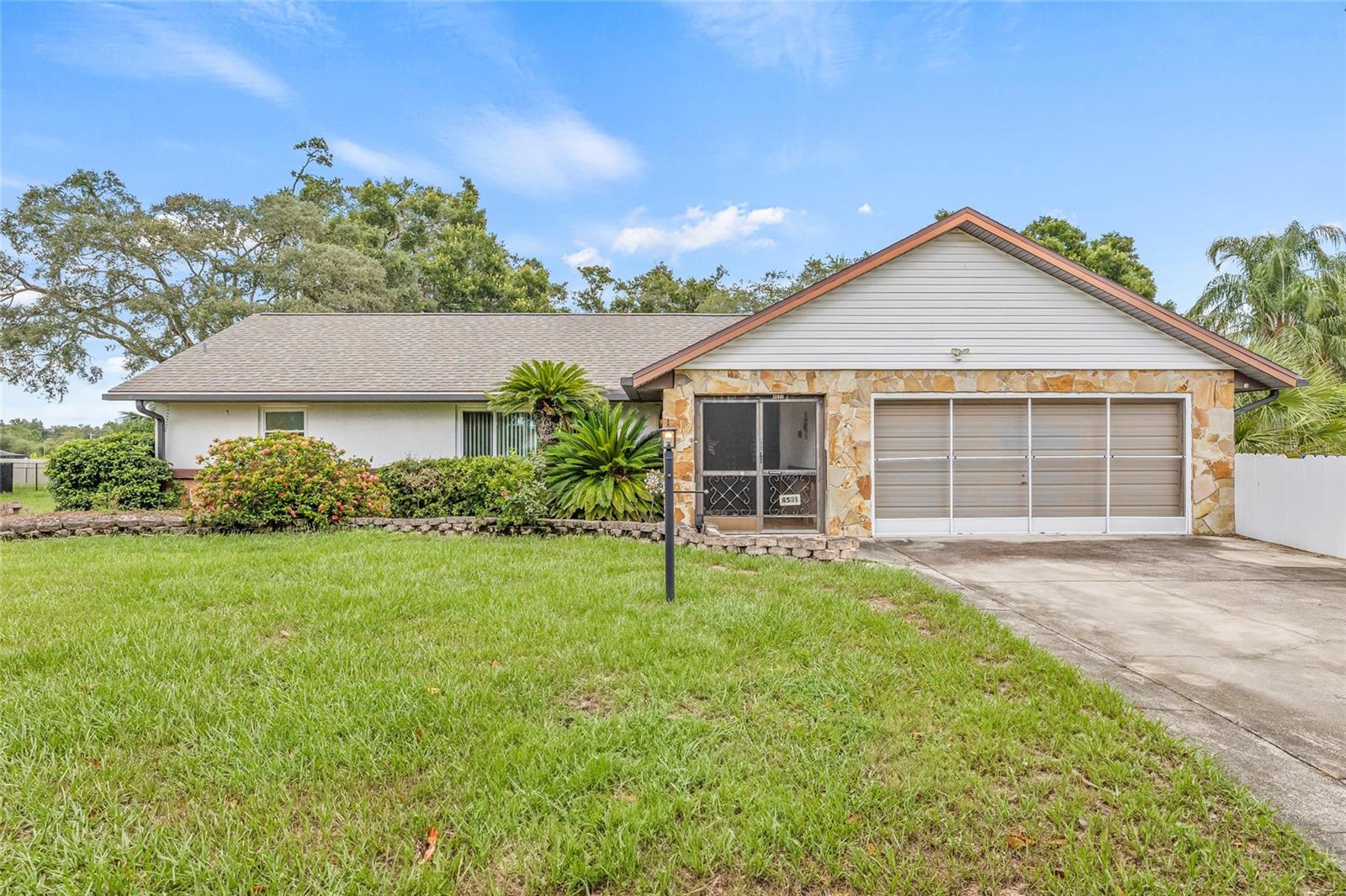 One or more photo(s) has been virtually staged. Pool Home on Nearly Half an Acre in Valrico—No HOA!
This well-loved 3 bed, 2 bath pool home in Buckhorn Hills is bursting with potential. Built in 1982, it still holds its original charm—with a layout that makes sense, and upgrades where it matters most. Roof and windows replaced in 2022, A/C in 2017—big ticket items handled!
Inside, you’ll find a spacious 1,930 sq ft split floor plan with a pocket door that turns the additional two bedrooms and bath into a private guest wing. The primary suite offers a walk-in closet, en suite bathroom, and sliders that open straight to the pool. The third bedroom also has direct patio access, with a total of four sliding doors throughout the home bringing in beautiful natural light.
And the real showstopper? A massive screened-in pool area and private backyard—made for true Florida living. Whether you're hosting or relaxing, the large pass-through bar window from the kitchen to the patio makes it all feel effortless.
Love a cozy vibe? The stone fireplace in the living room brings it. Plus, there's a large shed out back for extra storage or a workshop.
Whether you’re ready to embrace its timeless character or remodel to make it your own, this home offers space, privacy, and location—all without an HOA. Homes in this established neighborhood are well-kept, and you’ll love the roomy feel with no homes stacked right on top of you.
Big home, big yard, big opportunity—and priced to move.