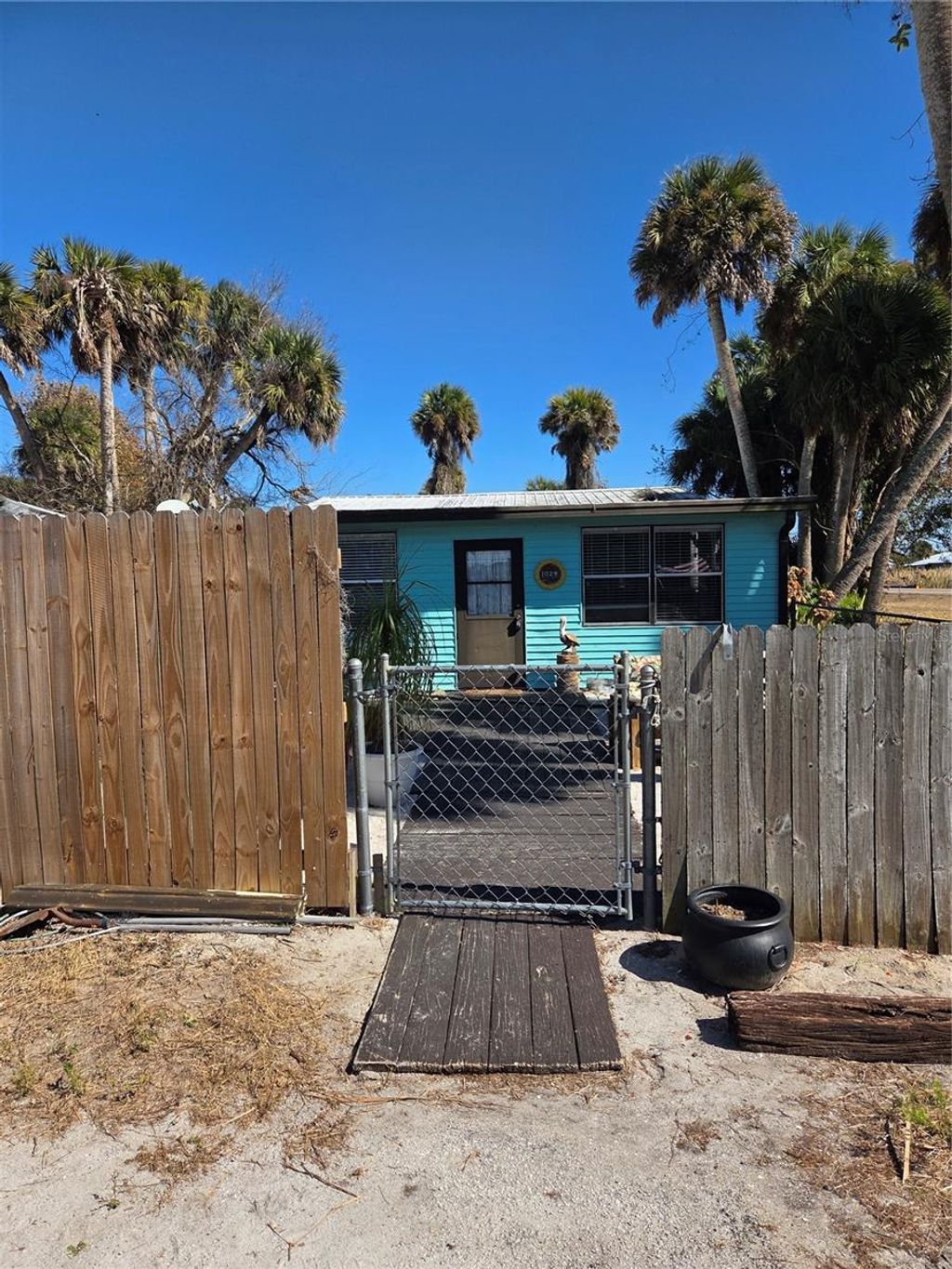 Photo of 1024 Strickland Road, Okeechobee, FL 34974 (MLS # C7521667)