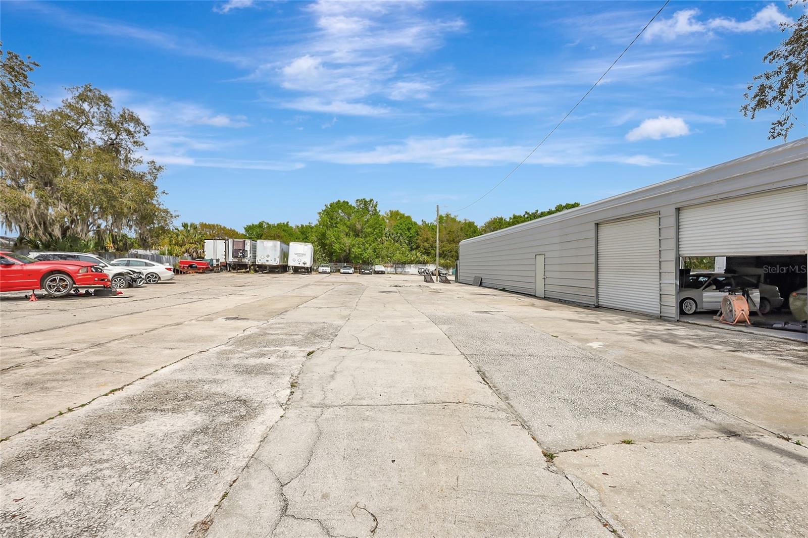 Rare Opportunity to own a county and state approved mixed use Auto property with licensing for a Junk Yard, Towing and Storage business. You may live on the premises or rent the Mobile Home. Prefab Metal Building is 3,508 square feet 94x36 with 4 10ft roll up doors and 1- 12ft roll up door, lift inside as well the 1978 Caterpillar Loader will be conveying. Also, a sperate building for painting autos. Many benefits to owning this gem. Value is in running a business on this approved property. Has a current EPA clean inspection letter.