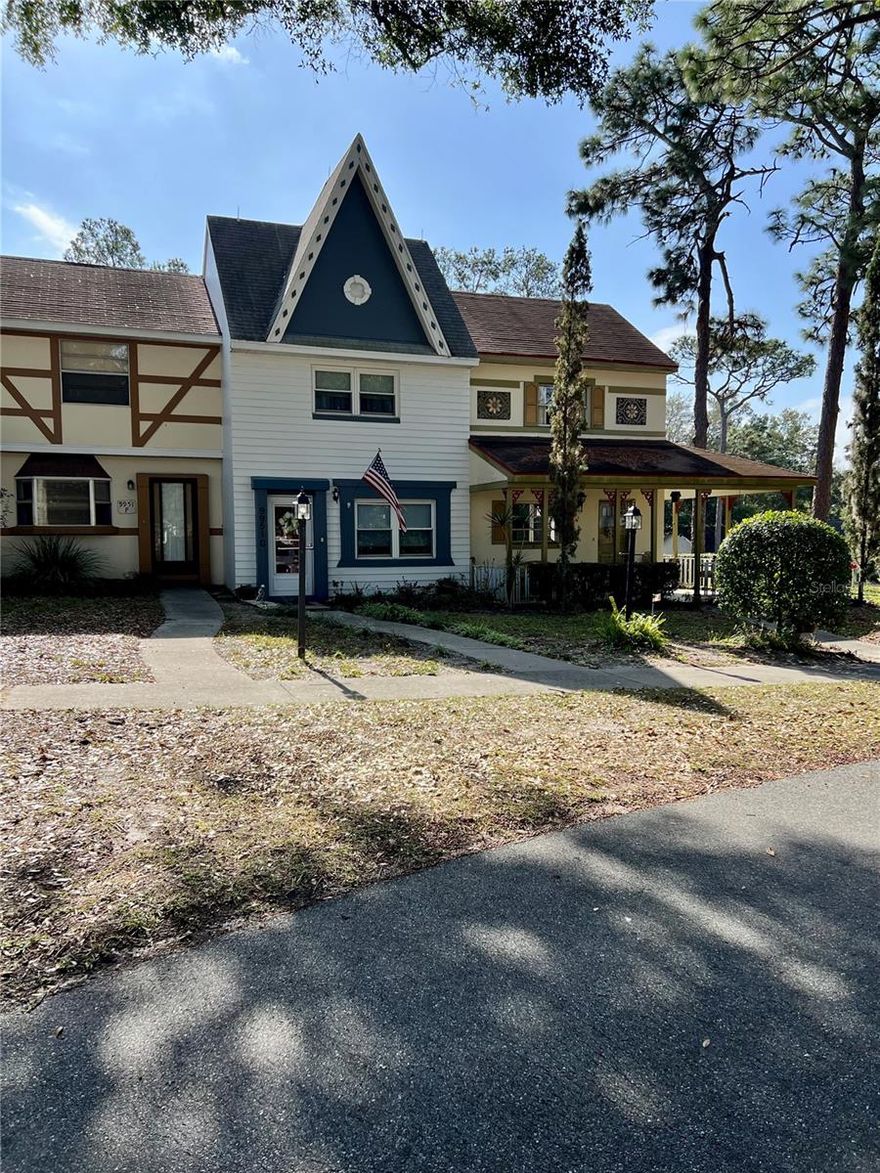 Welcome to this beautifully refreshed 2 bedroom, 2.5 bath townhouse located in the charming Americana Village, known for its vintage European-inspired setting. Thoughtful cosmetic updates throughout provide a fresh, updated look while preserving the character that makes this community so admired.

The inviting floor plan features a cozy living area with a fireplace that creates a warm connection between the family room and kitchen, ideal for everyday living or relaxing evenings at home. Each bedroom offers its own private bath, with an additional half bath conveniently located on the main level.

Enjoy a peaceful lifestyle surrounded by manicured grounds, including a gazebo nestled within a park-like setting—perfect for enjoying Florida’s beautiful weather. This townhome offers easy golf cart access to nearby shopping, dining, and community conveniences. Residents also enjoy access to a wide variety of amenities designed to support an active and engaging lifestyle.

A wonderful opportunity to own a low-maintenance home in a quiet, well-established community with timeless appeal.