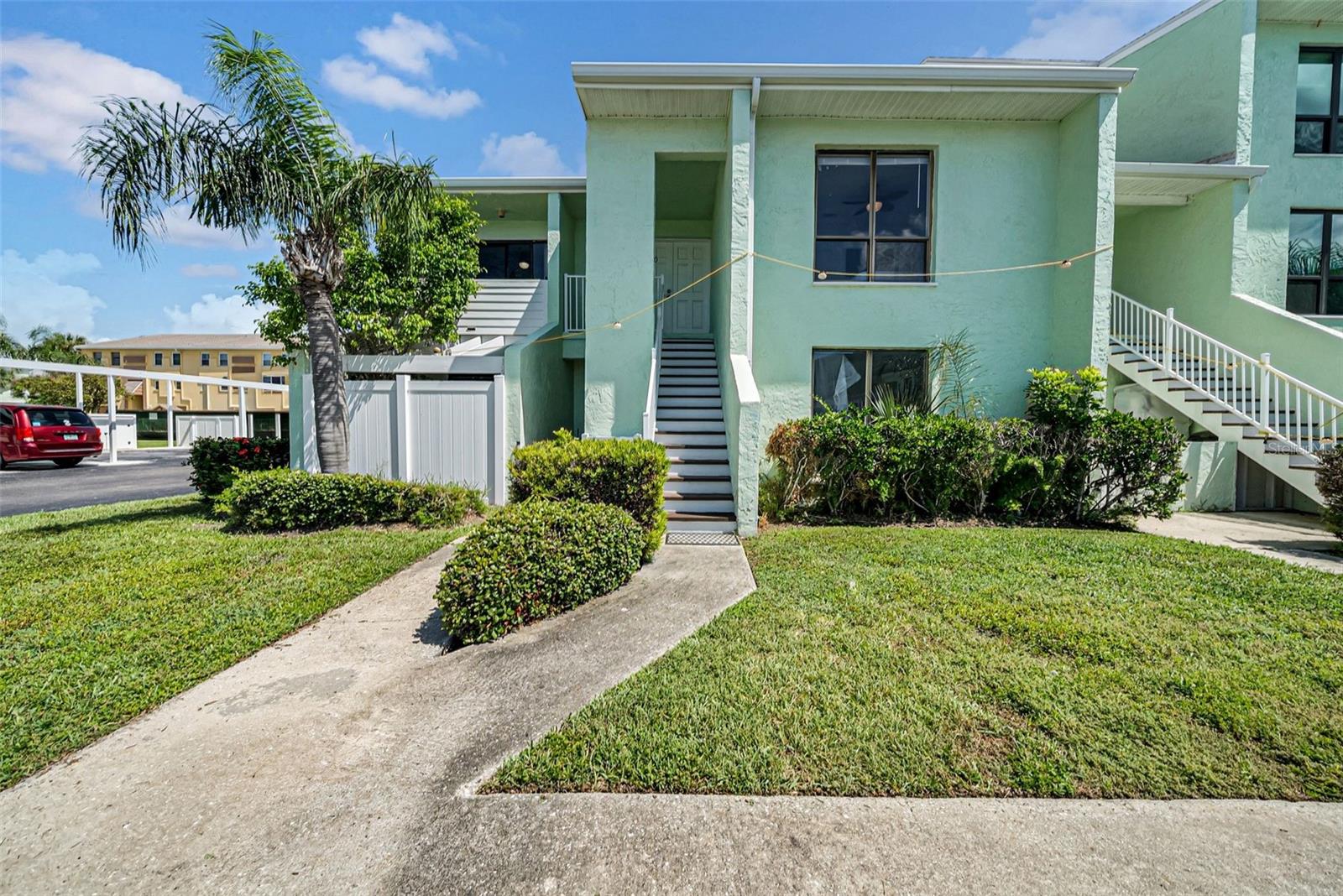 ** 2ND FLOOR UNIT WAS NOT AFFECTED BY THE STORMS *** (2 BED 2 BATH) Buy as a desired vacation rental or second home! ALL ages welcomed! UNIT COMES FULLY FURNISHED and TURNKEY with linens, extra pull out bed, beach chairs, fishing pole and so much more. LAUNDRY INSIDE UNIT! ASSIGNED COVERED PARKING & STORAGE steps from the unit. (AC 2017) Welcome to your piece of paradise with a view, in the heart of Indian Rocks Beach less than half a mile from the beach! This this tastefully updated, well appointed and meticulously maintained two-bedroom, two-bathroom condo is nestled in a very unique community that offers the ideal coastal lifestyle. As you step inside, you'll be immediately struck by the abundance of natural light that fills the living space, accentuating the beautiful new laminate flooring throughout. Master bedroom is very spacious with a large walk in closet and en suite bathroom. 2nd Bedroom has dual closets. Large enclosed Bonus Florida Room with a storage closet off the back of the unit. This unique community offers an array of fantastic amenities, including a clubhouse, a refreshing waterfront pool, shuffleboard courts etc. Picture yourself spending your leisure time by the poolside, savoring the Florida sunshine, and making new friends among your neighbors. Unit comes fully furnished and ready to rent or move in, just bring your swimsuit! Everything currently in the unit will convey to the new owners.*** HOA FEE COVERS, Cable TV, Internet, Pest, sewer, trash, water, community pool, exterior maintenance, grounds maintenance and more, ensuring hassle-free living. This unit will not last!