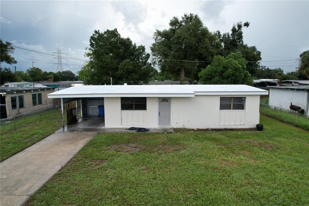 Photo of 1310 Warrington Way, Tampa, FL 33619 (MLS # TB8547342)