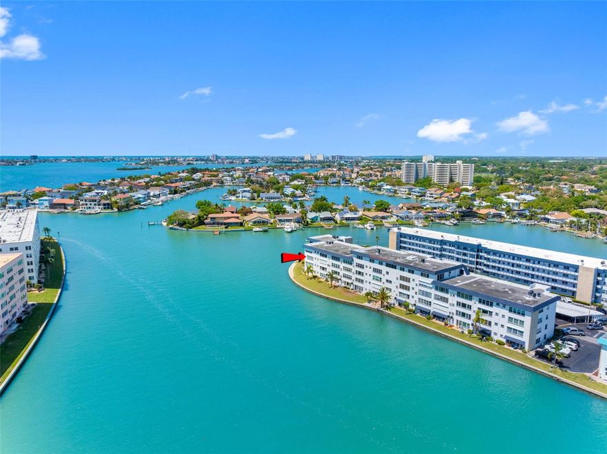 One or more photo(s) has been virtually staged. Check back for virtually staged photos arriving soon.  Gorgeous sunsets are your bonus every day in this beautiful corner location in the Hampton House, Town Shores!   Live the good life in this bright 3rd floor corner unit with dazzling views of Boca Ciega Bay and only a few minutes walk to Gulfport beach!  This waterfront condo has 2 bedrooms, 2 bathrooms and 1,250 square feet of living space--allowing plenty of room to enjoy easy living and host family and friends.  Once inside this spacious unit, you are greeted with an open floor plan with windows overlooking Boca Ciega Bay, as well as views stretching all the way to the shores of St Pete Beach.  The remodeled kitchen offers granite counters, upgraded cabinets, a colorful backsplash, recessed lighting and a gas range.  Your safety is ensured by hurricane resistant windows and additional protection offered by storm shutters. The living area is wide open waiting for your designer touch. The primary bedroom is large and roomy with an en suite bath featuring a step in shower and vanity with quartz counter.  The guest bath offers an updated vanity with quartz and a soaking tub.  There is assigned external storage, and  parking space #21 near the bldg. front door - plus plenty of available guest parking.  The laundry is conveniently located on same floor.   The heated, waterfront pool is only a short walk away.   The monthly fee includes cable TV, internet, common area taxes, community pool, escrow reserves fund, gas for cooking, insurance, exterior maintenance, grounds and pool maintenance, recreational facilities, sewer, trash and water.  One year waiting period for rentals, and no pets are allowed. Recent building improvements include a new roof and freshly painted exterior.  Hampton House has has passed the Milestone Inspection and SIRS.  Town Shore amenities include 4 heated pools, tennis, pickleball, bocce, a grilling area, kayak/boat launch and shuffleboard. An on-site management office is located in the 2 story Clubhouse along with organized activities including cards, billiards, game room, library, fitness room and his and hers sauna. A security officer is on duty nightly.  The North and South Docks with kayak launch include slips for rent and have been restored very recently. The Gulfport Art District is home to a variety of restaurants, shopping, galleries, Public Library and Senior Center . Don’t miss the monthly First Friday Art Walk with live music plus a Farmers Market every Tuesday morning.  Town Shores is close to the revitalized downtown St Petersburg, world class Gulf beaches, major sport venues, international airports and Disney World. Close to everything, yet a world away! Town Shores is a premier 55+ community in Pinellas County. This is resort style living at its finest!!