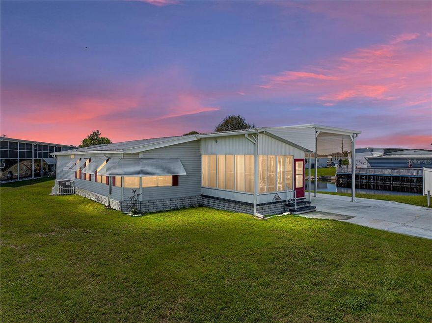 Discover the captivating charm of this well-maintained, move-in-ready waterfront RV Port Home. This property features 2 bedrooms and 2 bathrooms on a spacious half-acre lot with 250 feet of canal frontage. From the moment you step inside, you'll be welcomed by beautiful laminate floors that seamlessly connect the living areas and bedrooms. The inviting front sunroom serves as a perfect retreat for relaxation and leisure.

This exceptional home boasts a spacious interior that includes an elegant formal dining area complemented by custom built-ins. The well-equipped kitchen is a chef's dream, featuring a cooking island, a brand new cooktop and oven, and ample cabinet space—ideal for anyone who enjoys cooking. Additional highlights of the property include a durable metal roof, new plumbing, an impressive 80-foot motorhome port, a comfortable air-conditioned bonus room, and a versatile storage shed that can serve as a workshop or extra storage.

Located in Mount Olive Shores, a friendly and secure gated community dedicated exclusively to Class A motorhomes, this home offers a unique lifestyle. To maintain the exclusivity of the neighborhood, residents are required to own or lease a Class A RV during their first year of residency. 

Don’t miss this incredible opportunity—schedule your showing today and seize the chance to claim this gem before it’s gone!