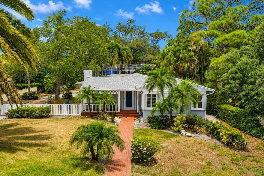 Nestled along one of Dunedin's most scenic waterfront corridors, this rare flood-damaged property presents an exceptional opportunity to renovate, reimagine, or build new on an oversized 75 x 139-foot lot totaling more than a quarter acre. With picturesque views of St. Joseph Sound and the Intracoastal Waterway, this is a prime location for investors, builders, or buyers seeking to create a custom residence in one of Tampa Bay's most beloved coastal communities. The existing home offers nearly 2,000 square feet of living space with three spacious bedrooms, each featuring its own private bath, roof (2020), hurricane shutters, along with a two-car garage and a large fenced backyard shaded by mature landscaping. Whether you choose to restore the home to its former charm or design a new coastal retreat, the possibilities are extraordinary. Location is everything, and this address delivers the very best of Dunedin living. Situated steps from iconic Edgewater Drive, just two blocks from the vibrant downtown district and only one block from the Pinellas Trail, you are moments from boutique shopping, award-winning restaurants, breweries, the Dunedin Marina, waterfront parks, and the TD Ballpark, spring training home of the Toronto Blue Jays. Directly across the street, the historic Fenway, Autograph Collection offers waterfront dining, live music, and a rooftop bar with breathtaking sunset views. From this coveted location, you can stroll to nearly everything that makes Dunedin so special, hop aboard the Trolley for an easy ride to Clearwater Beach or Tarpon Springs, and enjoy spectacular sunsets over the water each evening. Opportunities like this are increasingly rare. Bring your vision and unlock the tremendous potential of this premier Dunedin waterfront location.