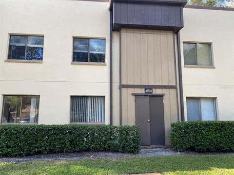 Photo of 11720 Raintree Lake Lane #B, Tampa, FL 33617 (MLS # TB8527604)