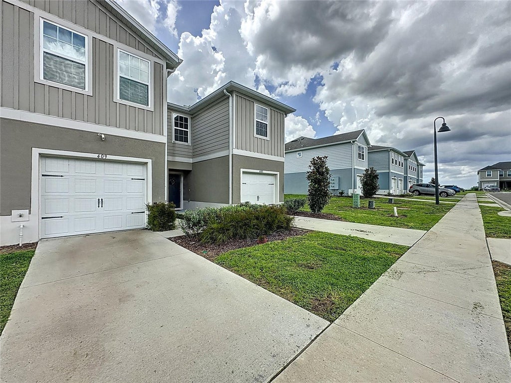 Photo of 409 Sedgewick Drive, Davenport, FL 33837 (MLS # S5158589)