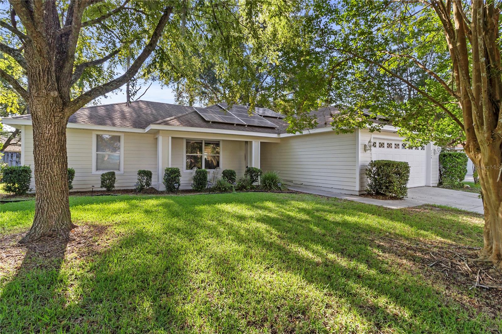 This beautiful three-bedroom and two-bathroom home nestled in the desirable Pool Community of Capri offers comfort, charm, and thoughtful updates throughout! The house is 1,435 sf and features a split floor plan, a large kitchen with breakfast area and bay window, vaulted ceiling, a specious master bedroom with walk-in closet, a screened lanai overlooking a fenced back yard. House has many updates such as new kitchen flooring, new garage door, new garage exterior lights, new front door with the custom glass design and freshly painted exterior. New roof was installed in September 2020. Enjoy your green living with Solar panels 2022 for energy saving purposes at no extra charge! The house is one street away from the community pool. This friendly and inviting Capri community offers fantastic amenities, including a pool, gym, clubhouse, tennis courts, and access to scenic walking and biking trails. Capri is conveniently located in northwest Gainesville near dining, shopping, hospitals and the University of Florida.
