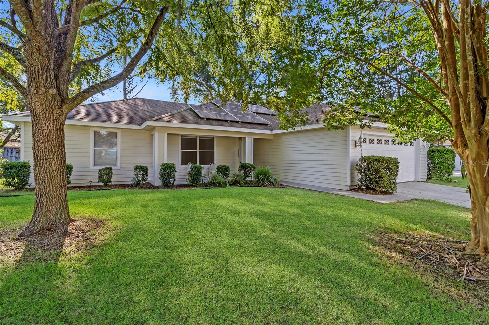 This beautiful three-bedroom and two-bathroom home nestled in the desirable Pool Community of Capri offers comfort, charm, and thoughtful updates throughout! The house is 1,435 sf and features a split floor plan, a large kitchen with breakfast area and bay window, vaulted ceiling, a specious master bedroom with walk-in closet, a screened lanai overlooking a fenced back yard. House has many updates such as new kitchen flooring, new garage door, new garage exterior lights, new front door with the custom glass design and freshly painted exterior. New roof was installed in September 2020. Enjoy your green living with Solar panels 2022 for energy saving purposes at no extra charge! The house is one street away from the community pool. This friendly and inviting Capri community offers fantastic amenities, including a pool, gym, clubhouse, tennis courts, and access to scenic walking and biking trails. Capri is conveniently located in northwest Gainesville near dining, shopping, hospitals and the University of Florida.