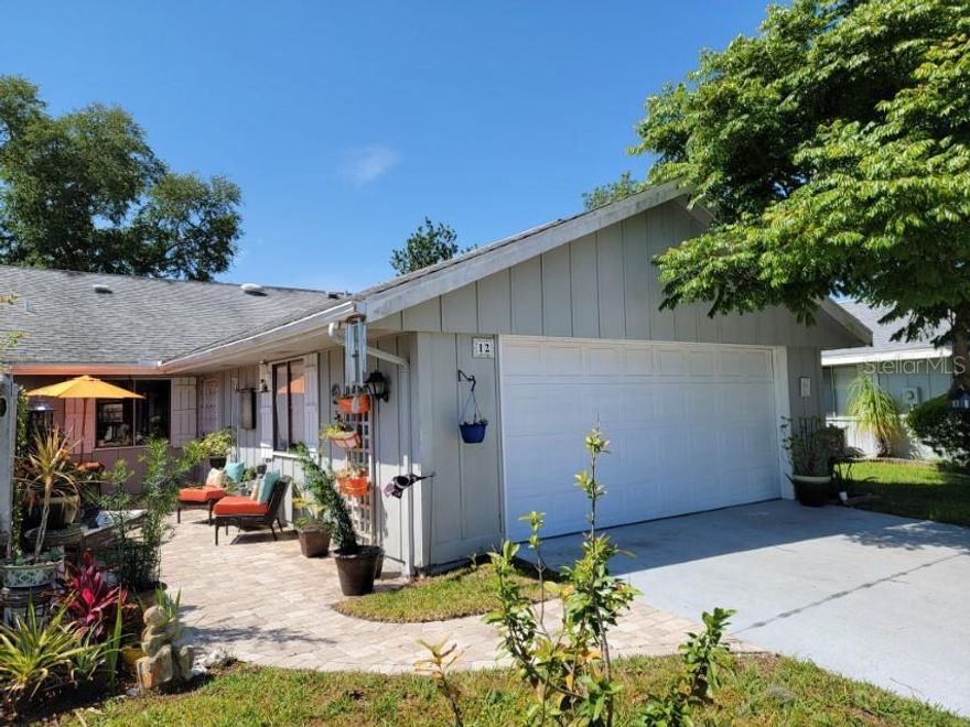 Beautifully updated home with gorgeous new  bathrooms and kitchen. Modern kitchen has been opened up to the dining and living area, and features tile backsplash, updated stainless steel appliances, granite countertops, wood cabinets and nice island with seating to enjoy your morning coffee overlooking the courtyard entry. Designer tile floors throughout living area and bathrooms, and carpet in bedrooms. Florida room has wood laminate floors and features wall A/C unit providing an additional 240 SF of living space that is not included in the 1252 SF of central A/C. living space. Lovely fenced patio at rear of home provides  private outdoor space in which to relax under the shade of gorgeous oak. Courtyard entry features pavers and screened entry porch with iron gate.  Bathrooms have been updated with new fixtures, cabinets, toilets and tile showers. Lots of cabinet and closet space throughout, providing all the storage space you could want. Low HOA dues provide irrigation system and water to sprinklers, termite bond and common area maintenance.  Great central location, close to everything, including historic Canal Street shopping and dining, and the beach is a less than 10 minutes away. Nestled between 2 golf courses, with community heated pool that is available by optional membership. ;Water: City