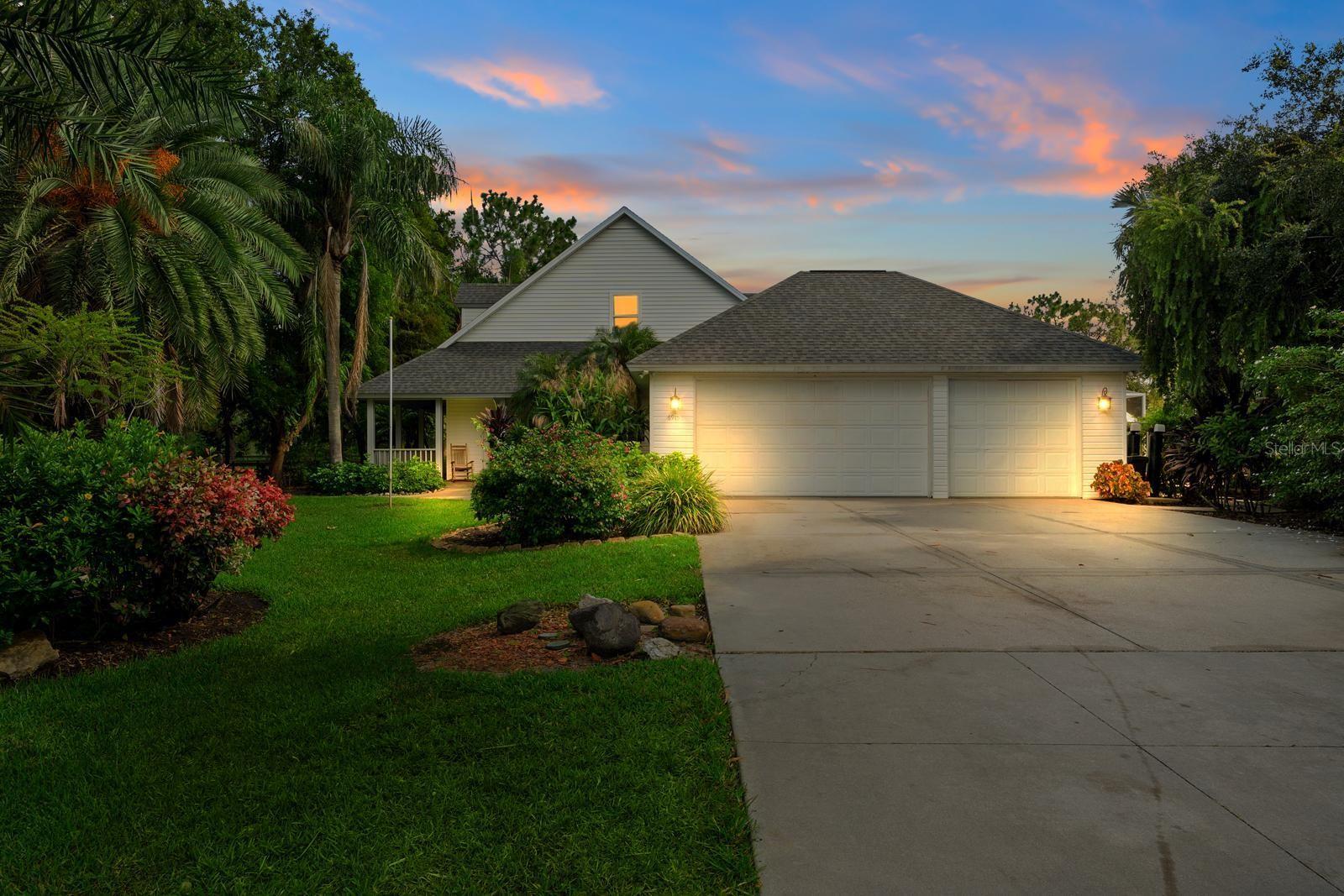 Experience luxury, privacy, and peace of mind in this stunning 5BR/4BA estate crafted by renowned builder Roland Yoder, set on over 9 wooded acres in Panther Ridge. Featuring 4,111 SF of living space, this custom home includes a remodeled kitchen with bamboo cabinets, granite counters, and stainless appliances, a luxurious first-floor primary suite, oak floors, and impact-rated doors/windows throughout. Recent upgrades ($300K+) include a new roof (30-yr warranty), HVAC, septic, pool pump, propane tanks, and more. Enjoy resort-style outdoor living with a heated pool/spa, summer kitchen, travertine deck, fire pit, tiki hut, tropical gardens, and two massive outbuildings: a 6-stall concrete barn and an oversized workshop. Plenty of space for the whole family and your four legged friends. Fully fenced with 4 pastures and access to 15 miles of trails, this rare property offers unmatched style, function, and storm resilience and is just minutes from Lakewood Ranch.