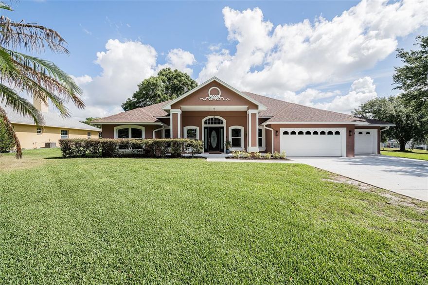 Rare opportunity in Lake Juliana Reserve with private boat ramp access, oversized lot and boat garage. Welcome to where spacious living, modern updates and an exceptional lifestyle come together in one of Auburndale’s most desirable communities within close proximity to Berkley Charter Schools. Situated on just over half an acre, this beautifully updated 4-bedroom, 3-bath residence offers 2,278 square feet of living space and over 4,100 total square feet under roof. From the moment you arrive, you’ll appreciate the home’s inviting layout, generous living areas and thoughtful upgrades throughout. Inside, the home has been extensively refreshed with all-new interior and exterior paint (2026), beautiful porcelain tile flooring throughout and an updated kitchen with custom all wood cabinets, all designed for both everyday living and entertaining. Natural light fills the home, while partial views of Lake Juliana create a peaceful backdrop. Major system updates provide added confidence for years to come, including a roof and A/C replaced in 2018, water heater (2025), new well water pump (2026) with transferable 2-year warranty and a new water conditioning system (2026), also with warranty. Outdoor living is equally impressive with an expansive 800-square-foot enclosed patio, offering the perfect flex space for relaxing, entertaining, game nights, or indoor-outdoor gatherings year-round. For boating and car enthusiasts alike, the oversized 35’ x 12’ under-roof third-car garage is a standout feature, currently configured for boat storage but versatile enough for additional vehicles, golf carts, workshop space, or recreational equipment. Residents enjoy private neighborhood boat ramp access to Lake Juliana and outdoor lovers will appreciate being just moments from the Van Fleet Trail. With its combination of space, upgrades, oversized lot and sought-after lake lifestyle, this move-in-ready home offers a rare opportunity in the heart of Auburndale. This home is minutes from I4 via the Polk County Parkway. Schedule your private showing today!