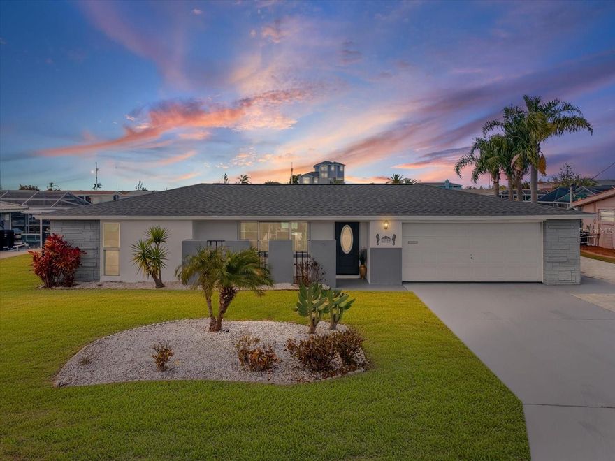 Experience the pinnacle of coastal living in this meticulously updated residence, perfectly situated on a massive lot and a half with an impressive 90ft of saltwater frontage!!  Designed for the ultimate boating lifestyle, this home offers seamless access to the Gulf of America with a suite of high-end outdoor amenities. Step inside this luxurious home and absorb the sun-drenched, open concept floor plan that is illuminated by sleek LED lighting throughout.  The fully renovated chef's kitchen will delight every cook as they prepare the daily catch!  Gorgeous stainless-steel appliances, trendy farmhouse sink and ample counter space for entertaining on this granite masterpiece. Retreat to the spacious bedrooms featuring custom cedar closets for a touch of natural warmth.  The spa like bathroom has contemporary finishes and designer tile work that will delight you after a day on the water!  Let's not forget the rare 2 car garage that comes with this property that is going to give you ample space for storage and parking!  Now step outside into the massive yard finished with designer pavers that lead to your spectacular 2nd kitchen overlooking the water, just waiting for your BBQ days and cold drinks! Built in BBQ, brand new fridge, ample storage space, and all undercover of a wooden gazebo with stunning lights for evening entertainment.  Step over to the built-in fire pit just waiting for the s'more nights!  If that's not enough come and elevate your outdoor lifestyle with the crown jewel of this costal retreat, your very own luxury swim spa, perfectly positioned on your expansive waterfront to not only overlook the water and it's spectacular sunsets but allows you to gaze up at all the stars every night!  This stunning centerpiece is a private wellness center and social hub all in one!  This amazing feature will allow you to be in the water day or night any time of the year!  Family, friends or just for you, either way you will never get enough of all that you have in this outdoor retreat!  Brand new roof with 3rd nail to help with insurance, new AC, so many more things to discover the list is endless so come and check it out for yourself, you won't be disappointed!!  This is not just living the salt life dream, this is taking control of it and enjoying all that life hold dear in this amazing setting so close to everything.  Restaurants just a golf cart ride away, shopping, medical all within minutes and Tampa international less than an hour away.  Who could ask for more?  Come and see for yourself, even your fur babies will love the fenced in yard and you will love the peace of mind that comes with it!!