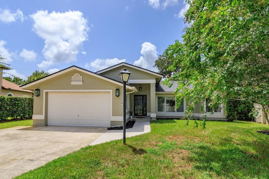 Imagine the chance to wake to your own LAKEFRONT views on sparkling LOST LAKE. One of the largest lots on this gorgeous 72-acre lake and homesite offers boating and all the beauty of lakefront living while storing your boat in your private boat house with boatlift. There's nothing like unwinding at the end of the day and weekends with boating, fishing, paddle boarding and bonfires in the fall chill among the trees.  Inside you'll find a one of a kind large, OPEN CONCEPT feel as you enter from the COVERED PORCH ENTRY which OVERLOOKS THE LAKE from the kitchen and FLEXROOM. The home is illuminated from all sides in light and offers the perfect flow from front to back, ideal for game days, block parties, etc.  Need room for the in-laws or studio? Consider expanding if you'd like to add on as there's no HOA, only city approval needed. This CONTEMPORARY-STYLE home went through a major renovation to include a NEW ROOF in 2022, kitchen rehab with plank quartz breakfast bar area/countertops, high end STAINLESS STEEL APPLIANCES, grey subway and arabesque accent mosaic backsplashes with WHITE SHAKER- STYLE CABINETS and more. Extended garage and extra large lot give you ample space for tools/toys and more. Where else can you find an acre lot on a lake close to everything in Oviedo and Orlando? Property is NOT in a flood zone and does not require flood insurance. Don't Miss the Chance to CALL THIS ONE HOME!