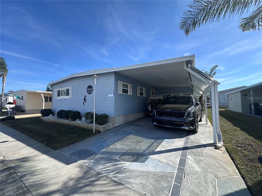 Looking for a home that with space galore and comes with a golf cart? Look no further. NEW roof in 2023, NEW A/C in 2017, Vapor Barrier, Water Heater, Water Softener and Sprinkler system all updated in 2018. Newer Windows, Driveway Coating, Appliances, Furniture and is ready for its new owner. This 2 bedroom 2 bath home, has 2 separate living areas to make both the sports nut and the rest of the family happy watching their own favorite shows.  Need more storage? You'll find it here, with 2 walk-in closets for all those extra winter clothes you brought to Florida but will rarely wear and an oversized shed. Enjoy your down time relaxing with friends in the 3 season screened room or the screened back lanai.  This fully furnished home includes washer & dryer, fully loaded kitchen with dishes, pots pans and kitchen supplies. The MASSIVE he/she shed has double doors to bring in you golf cart, built in shelves, a work bench, and a water tub for washing off all the grime. Fairway Village is a spacious, premier manufactured home community. A perfect place to live your dream, whether you stay year-round or spend some months elsewhere. A Resident Owned Manufactured Home Community of 751 homes for persons 55-plus years of age. Located in sunny Largo, on Florida's Gulf coast and close to many of Florida's major attractions. We offer a feeling of spaciousness with our wide curbed streets with streetlights and sidewalks. All homes are located with established setbacks from the street. Amenities include: A private 9 hole par 3 golf course with two lakefront fairways and a practice putting green A five-plus acre lake for catch and release fishing Two swimming pools with hot tubs Eight sheltered shuffleboard courts A new 19,000+ sq. ft. Clubhouse was completed January, 2022, that includes the following: 700 seat Auditorium/Ballroom, Large commercial kitchen, Stage for chorus and programs, Separate conference rooms, Fitness center, Library, Billiard room, Card playing room, Sitting areas, Wi-fi service throughout. Fairway Village's 2025 maintenance fee of $420/month includes water, sewer, in-home high speed internet access, 220+ Spectrum cable TV channels, curbside trash pickup, lawn pest control and lawncare. 2026 Annual Golf memberships are available to residents for unlimited play. Non-members pay a $15 greens fee during season and $8 off season. The Fairway Village Social Committee (FSC) promotes and coordinates over 50 social activities. While the listing information is deemed reliable, please note, it is not guaranteed and should be independently verified for accuracy.