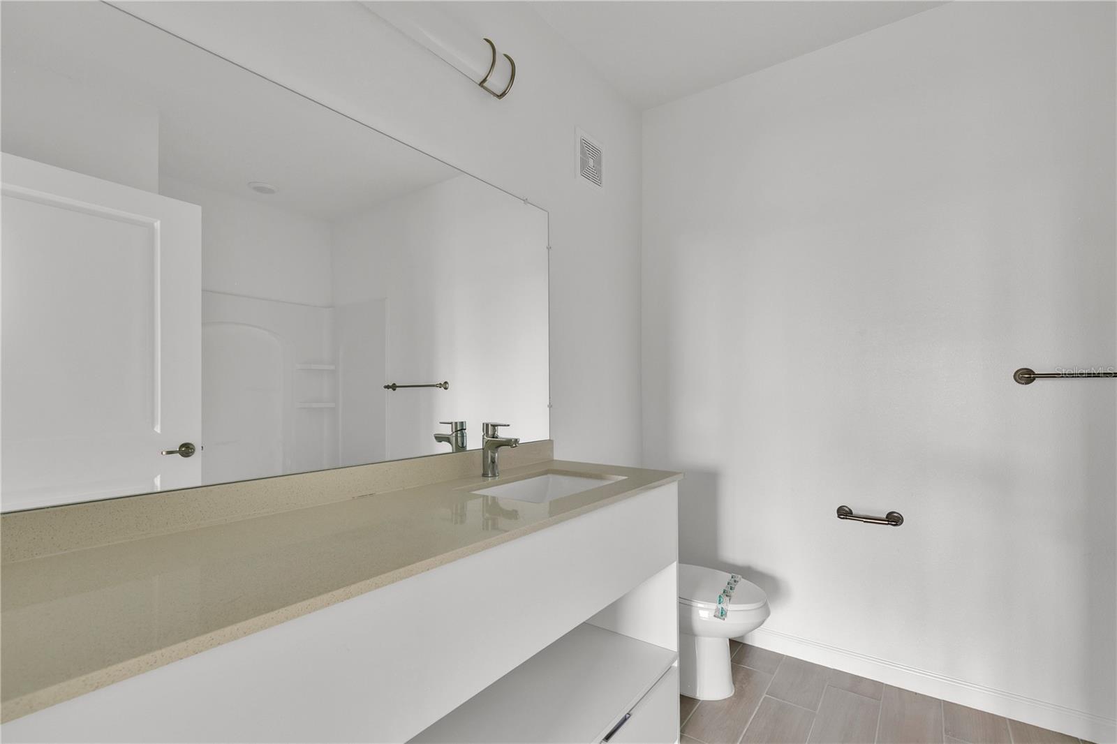 SANDLAKE STATION CONDOMINIUM 20240391386 UNIT 105 - Residential