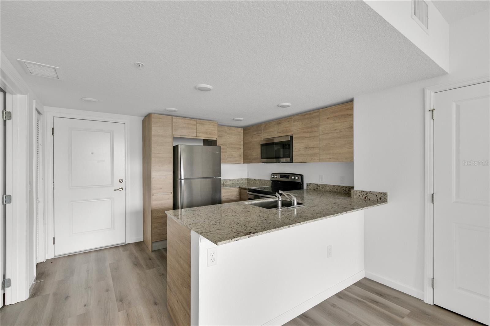 SANDLAKE STATION CONDOMINIUM 20240391386 UNIT 105 - Residential