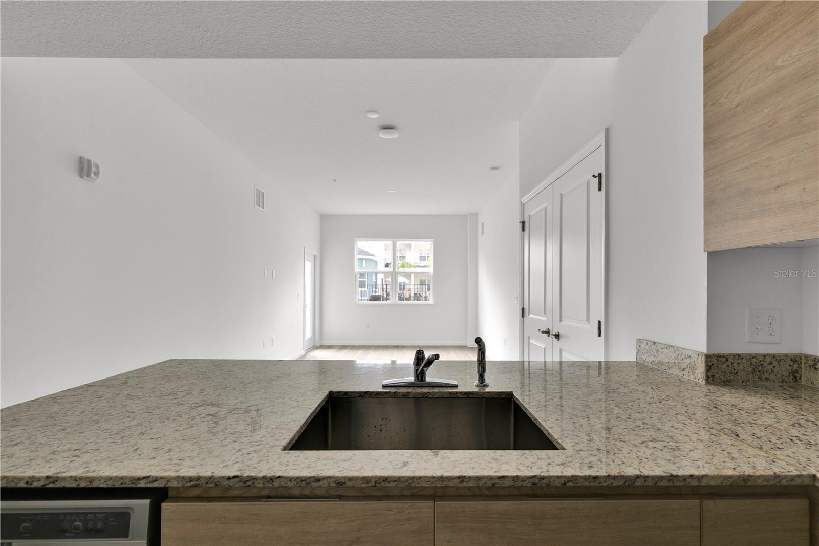 SANDLAKE STATION CONDOMINIUM 20240391386 UNIT 105 - Residential