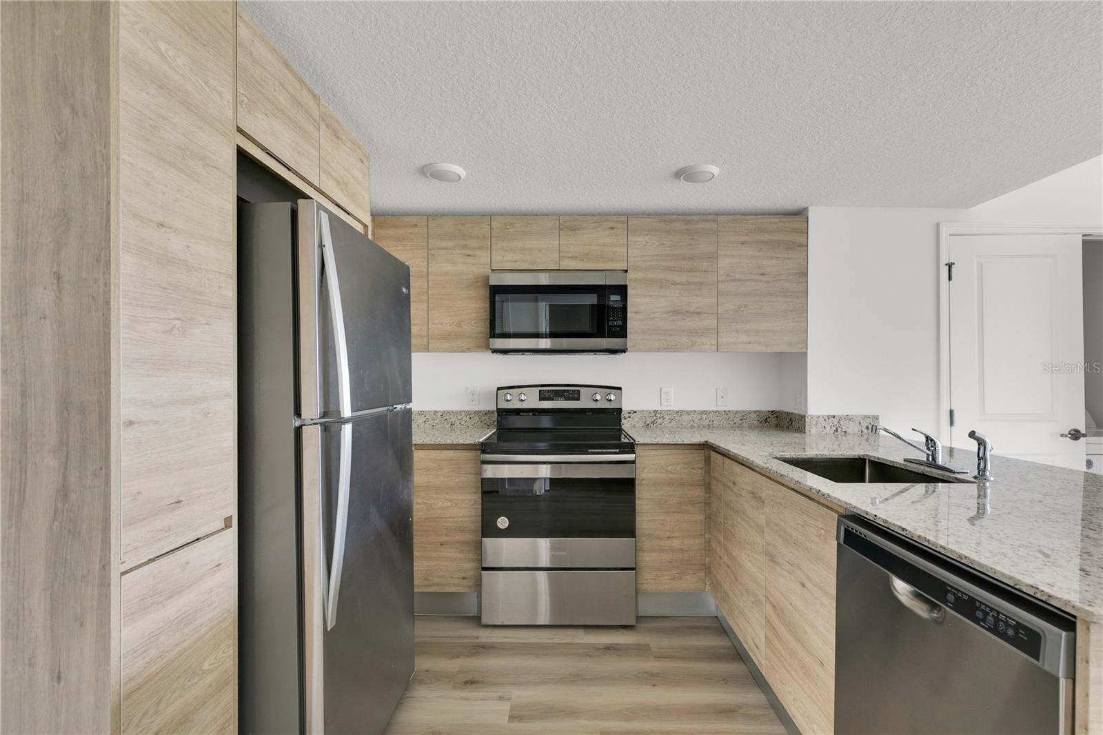 SANDLAKE STATION CONDOMINIUM 20240391386 UNIT 105 - Residential