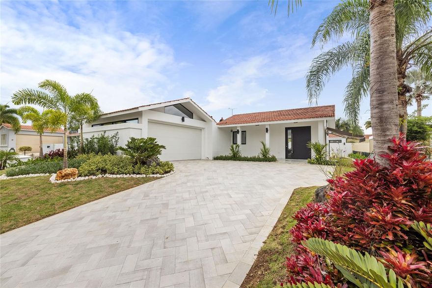 Welcome to this impeccably renovated property in the heart of Sabanera de Dorado. Boasting four bedrooms, each with its own en-suite bathroom and adorned with lofty high ceilings as you walk in, this house offers a luxurious living experience. The open kitchen concept is highlighted by a stunning waterfall island and brand new appliances, perfect for culinary enthusiasts.

What sets this property apart is its separate guest house, providing comfortable accommodation for visitors, ensuring a delightful hosting experience in Puerto Rico. With all-new windows and doors throughout, along with a beautifully paved driveway leading to a two-car garage, convenience meets elegance. The pool, featuring exquisite tiling and a cascading waterfall feature, is designed for low maintenance living, allowing you to indulge in leisure without hassle. Recently landscaped, the property exudes a tropical ambiance, inviting you to immerse yourself in its lush surroundings. Experience the epitome of luxury and relaxation in this stunning retreat.