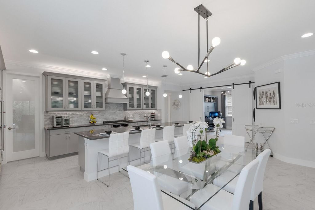 Photo of 5557 Long Shore Loop, Sarasota, FL 34238 (MLS # A4674783)