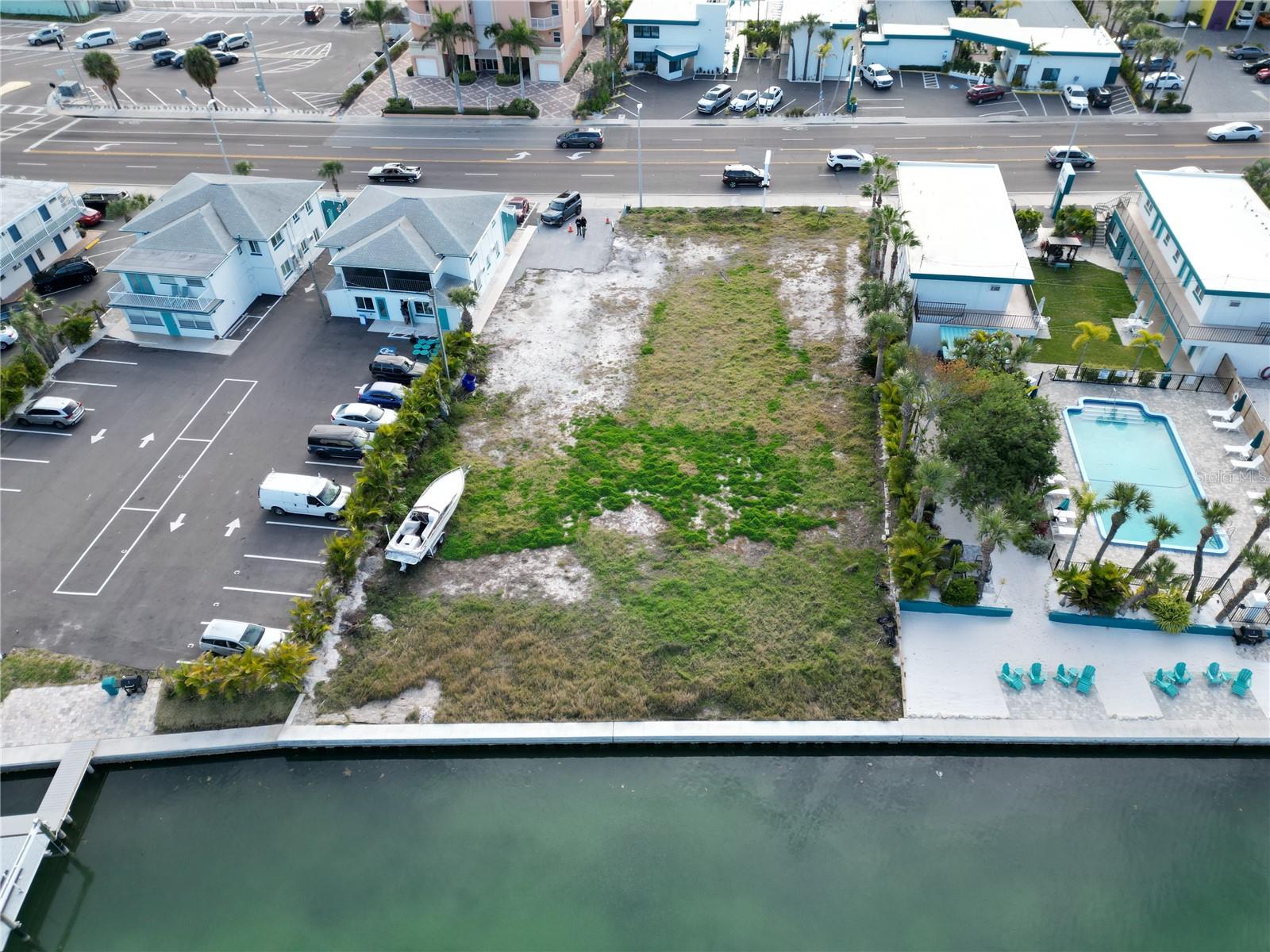 Auction Property. ...OWNERS’ HEALTH IS FORCING SALE……. EVERYONE WELCOME TO BID. Commercial Waterfront Property. Auction sale will be Held at the Site on Wednesday, July 17th at 10:00 AM. Preview starts at 9:00 am. This property may sell for more or less than the listed price. Zoned RFM-30 which allows nightly rentals plus many, many otheruses. See attachment for allowable uses. At no additional cost you will receive current permits and approved engineering plans for a ready-to-build 6-story Condotel with all necessary permits and approved engineering plans for 12 condo units, each with balconies offering views of both the Intercoastal Waterway and the Beach. Eleven units range from 1,072 to 1,555 sq ft, including balconie. Penthouse spans 2,892 sq ft with 1,252 sq ft heated. Owners can either self-manage or hire a property management company, with completed HOA documents ensuring smooth operation. Treasure Palms Resort offers excellent ROI potential, whether treated as a Condotel (e.g., Airbnb, VRBO) or by selling individual units. Public beach access and parking are just 200 feet away. Nearby amenities within a three-mile radius include hundreds of restaurants, bars, beaches, boating, fishing trips, and tours. The resort is within walking distance of lively restaurants and Tiki bars, and the wide beaches are perfect for activities like kite flying, reading under cabanas, and enjoying Gulf views. Paddleboards, kayaks, and beach toys are available for rent. Local attractions include the historic John's Pass fishing village, offering jet skiing, water skiing, boating, parasailing, dolphin tours, and unique retail shopping. Nearby beaches like Clearwater Beach, Honeymoon Island, Caladesi Island, and Ft Desoto State Park, along with the vibrant nightlife of St. Petersburg and Tampa, are also close by. Treasure Island boasts white sandy beaches, pristine waters, and family-friendly attractions, making it an ideal destination for vacation homes or permanent residences........ BUYER will receive a general warranty deed free and clear of all debts, guaranteed with a title insurance policy at closing.
