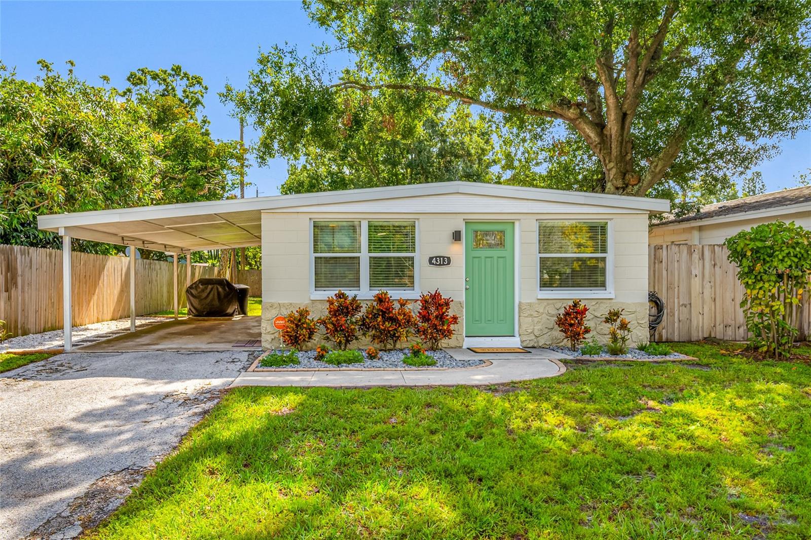 Looking for a move-in ready home in the heart of St Petersburg, then look no further! Come see this charming 3 Bedroom, 1 Bath home which was completely remodeled from top-to-bottom in 2016. From the moment you enter you will appreciate this home's open layout accentuated by its vaulted ceiling for a more spacious feel. The open Kitchen overlooks the Living Room and features granite countertops, wood cabinets, stainless steel appliances, tile backsplash, & LED lighting. Laminate flooring throughout with the exception of the bathroom & laundry room which have tile flooring. Windows have been replaced with double-pane windows. The versatile mini-split AC system offers greater energy efficiency & the convenience of zone specific temperature control. Fenced backyard provides a private & peaceful outdoor space. Recent improvements include new refrigerator, new lighting, & additional fencing. This home is NOT located in a flood zone and did not experience any flooding during the hurricanes. Convenient location with easy access to I-275 and short drive to vibrant Downtown St Pete & world-class beaches including St Pete Beach, Pass-a-Grille, & Fort De Soto Park. Don't miss this opportunity to make this home your own!