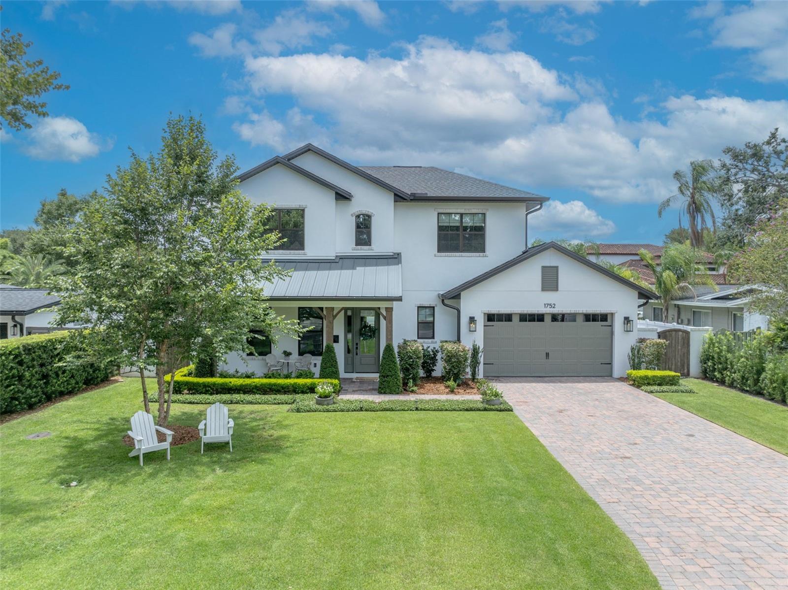 Timeless Elegance Meets Modern Comfort in Sought-After Tree Streets
Welcome to this thoughtfully designed, custom-built residence in the coveted Tree Streets community of Winter Park. Boasting 4 bedrooms, 4.5 bathrooms, and over 3,300 square feet of meticulously curated living space, this one-of-a-kind home perfectly blends craftsmanship, comfort, and style.
At the heart of the home, the chef-inspired kitchen showcases premium Thermador appliances, a gas range, and custom cabinetry that soars to 10-foot ceilings. The spacious butler’s pantry and built-in breakfast nook flow seamlessly into an inviting great room with custom built-ins—ideal for both everyday living and elegant entertaining. Nearby, the formal dining room features a striking drop ceiling, setting the stage for unforgettable gatherings.
Designed for everyday convenience and privacy, the first floor includes both a comfortable guest suite and a luxurious primary suite, which features elegant wood beams accenting the ceiling and creates a warm, sophisticated retreat.
Throughout the home, beautiful white oak floors add warmth and character, complementing the timeless design and enhancing the flow between each thoughtfully crafted space.
Enjoy effortless indoor-outdoor living with an expansive covered lanai featuring a built-in summer kitchen and phantom screens, all overlooking a stunning pool and spa embraced by lush landscaping. A dedicated pool bath ensures convenience for guests enjoying the outdoor oasis.
Inside, thoughtful features abound: a stylish mudroom with built-in storage, a large utility room with cabinetry and sink, and a conditioned mechanical room offering smart storage solutions. Upstairs, discover a spacious loft perfect for a media room or play area, accompanied by two generously sized bedrooms each with ensuite baths and ample closets.
The Stratford-style front porch invites neighborly chats, while the private backyard provides a serene retreat. Designer-selected finishes and custom touches are evident throughout, highlighting the home's timeless elegance and modern functionality.
Ideally situated just minutes from Park Avenue, residents will enjoy effortless access to fine dining, boutique shopping, charming cafes, museums, and the vibrant cultural heart of Winter Park.
A rare offering that combines luxurious design, exceptional craftsmanship, and the warm character only a custom-built home can provide—this residence truly stands out in the Tree Streets.